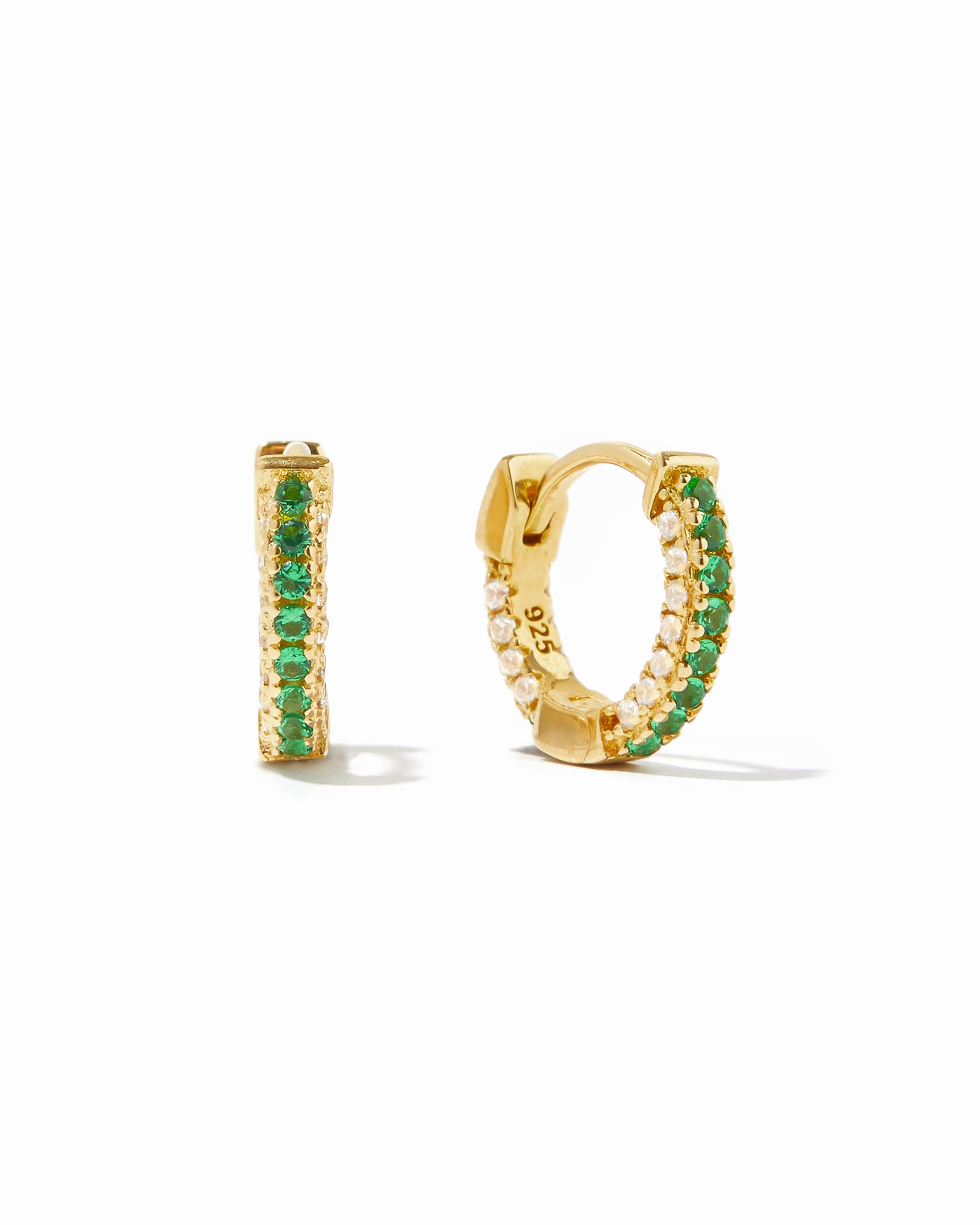 Gold pavé hoop earrings with emerald stripe.
