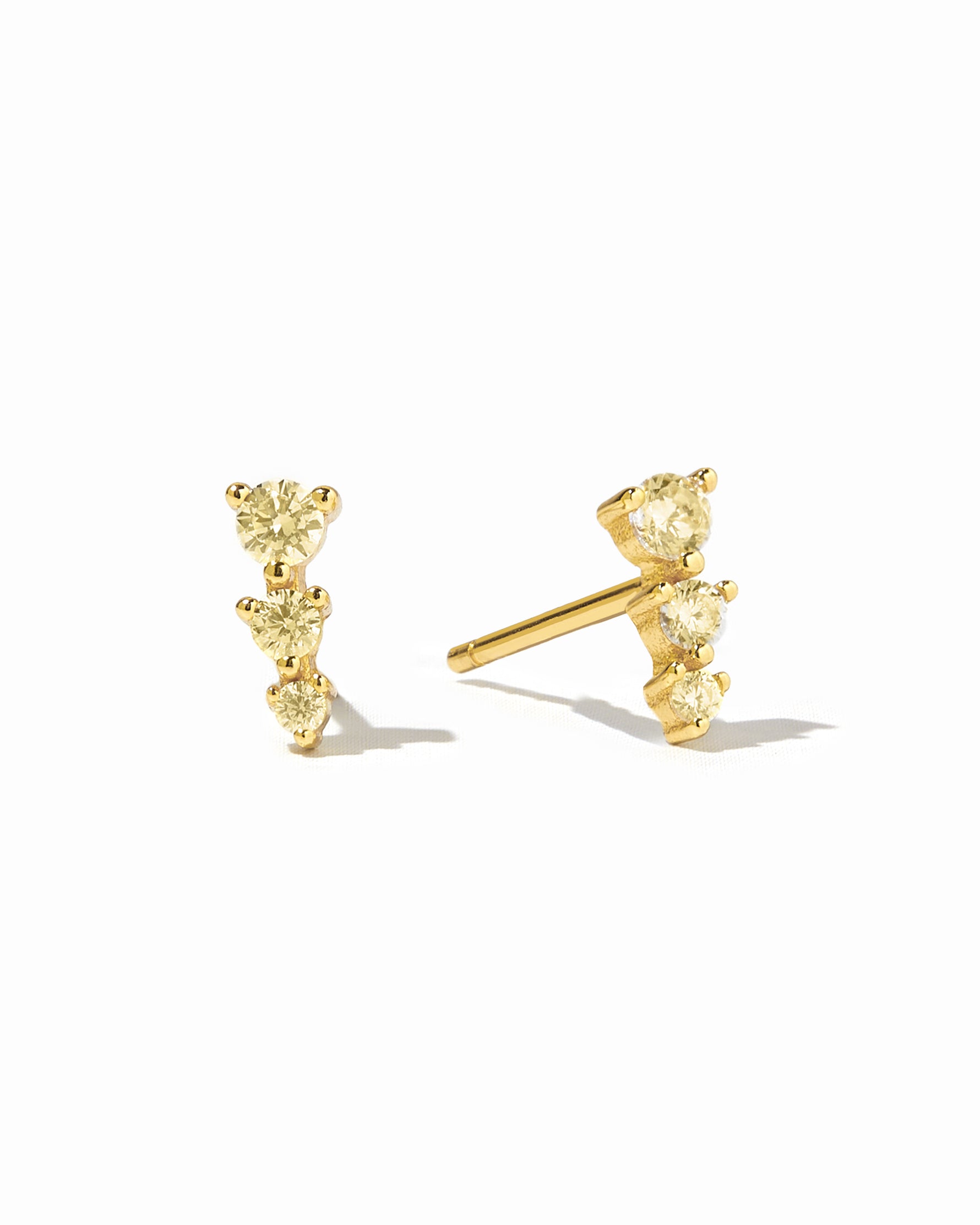 Gold yellow ear climber stud.