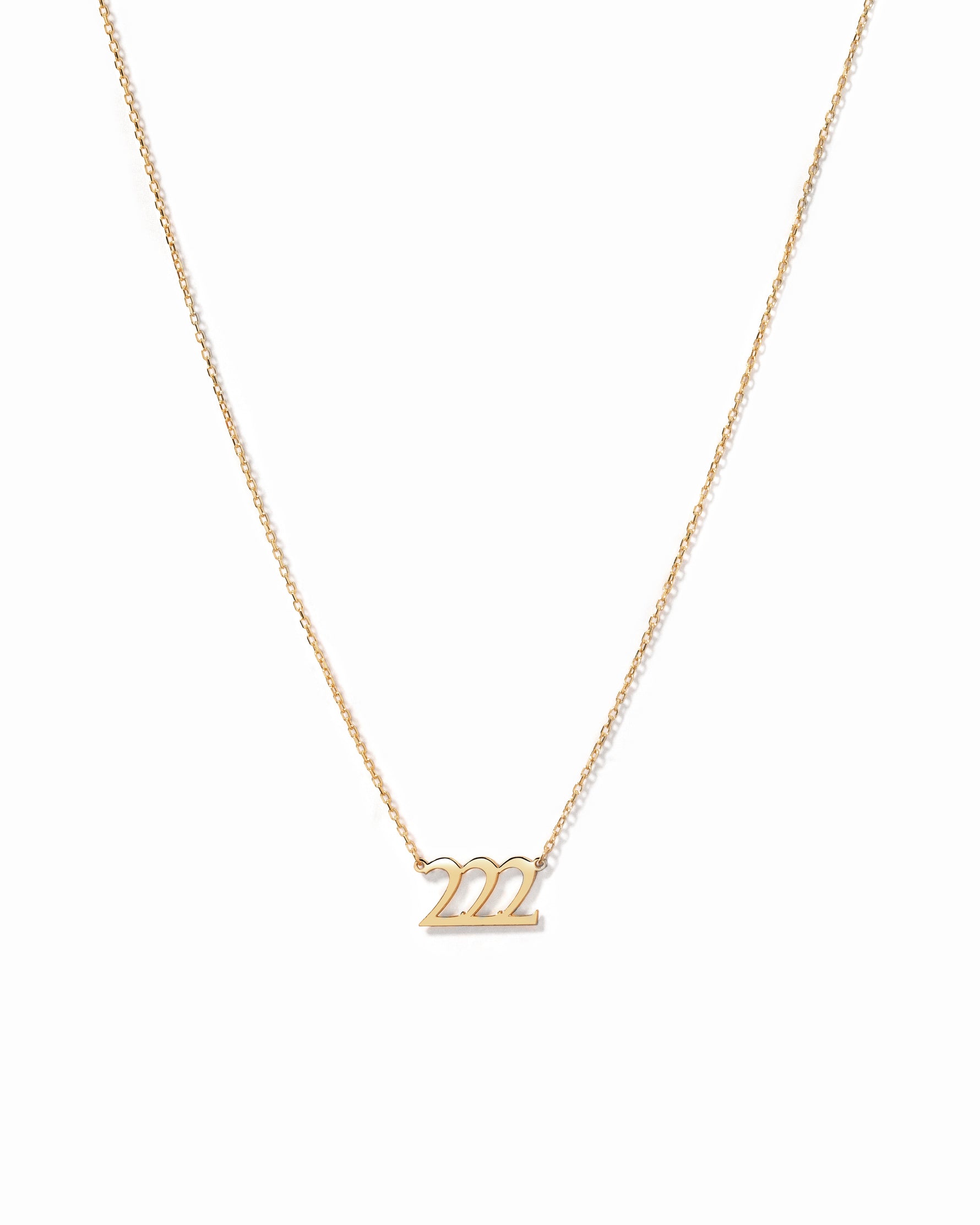 Dainty and minimalist gold 222 custom angel number necklace on white background