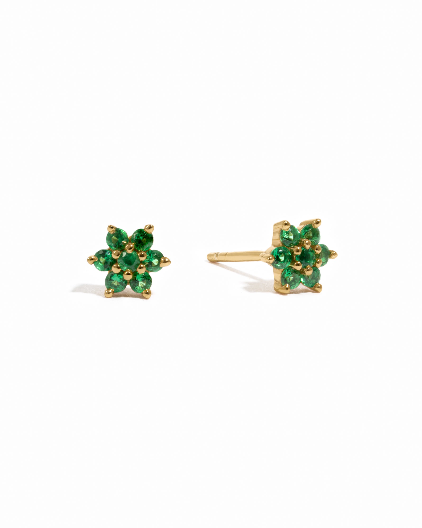 Gold delicate emerald gemstone flower stud earrings.