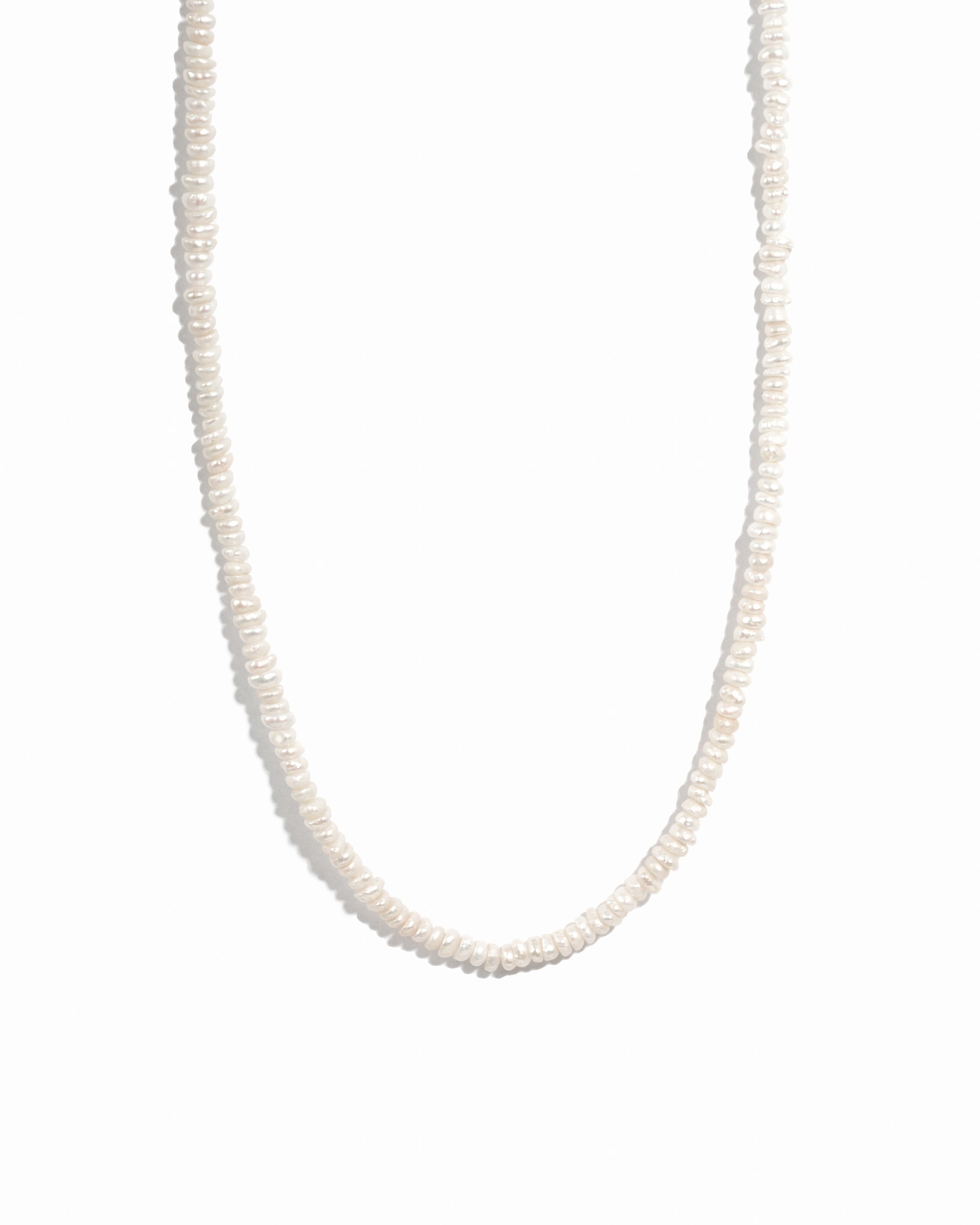 Freshwater beaded pearl necklace on white background