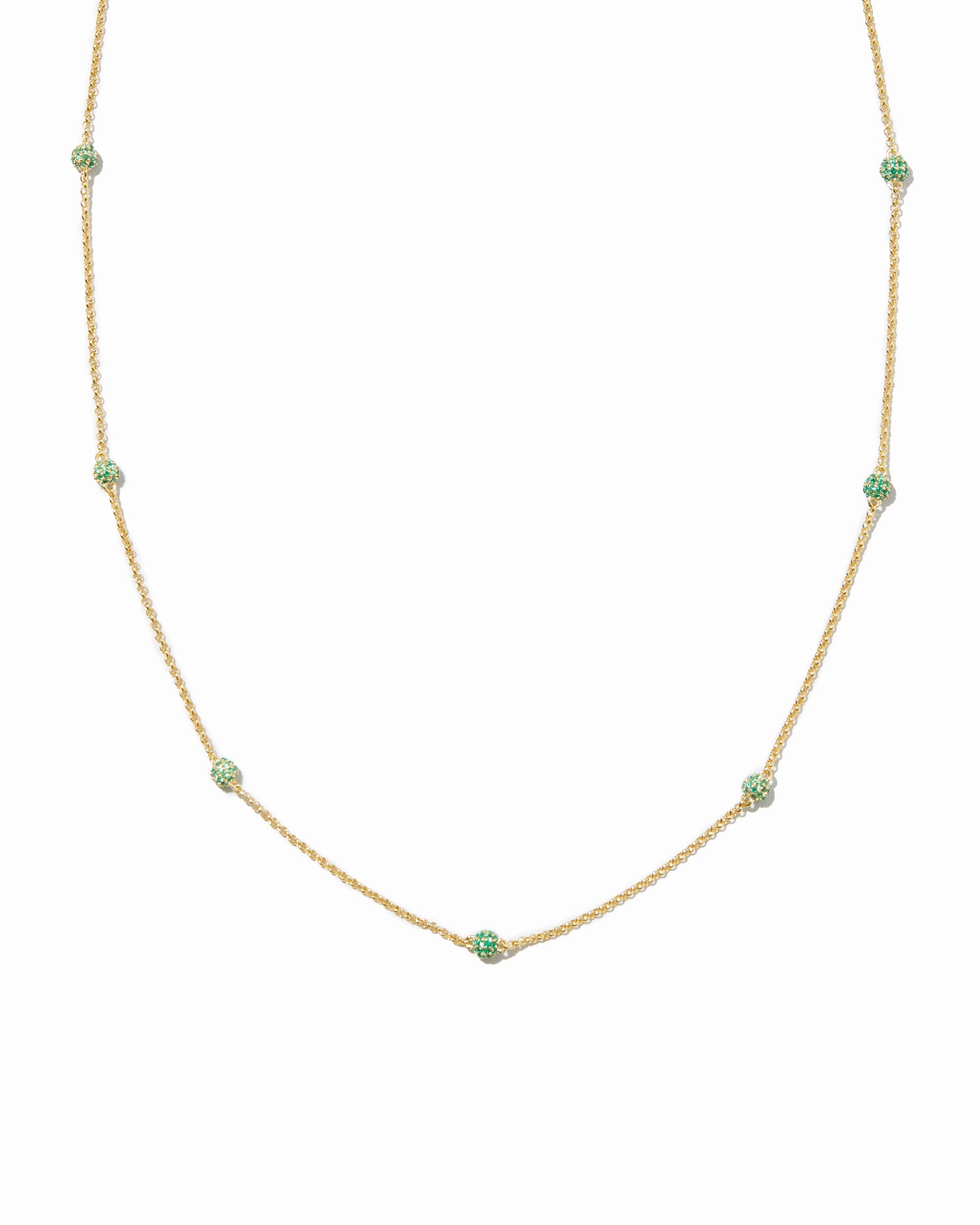 Emerald pavé beaded necklace on white background.