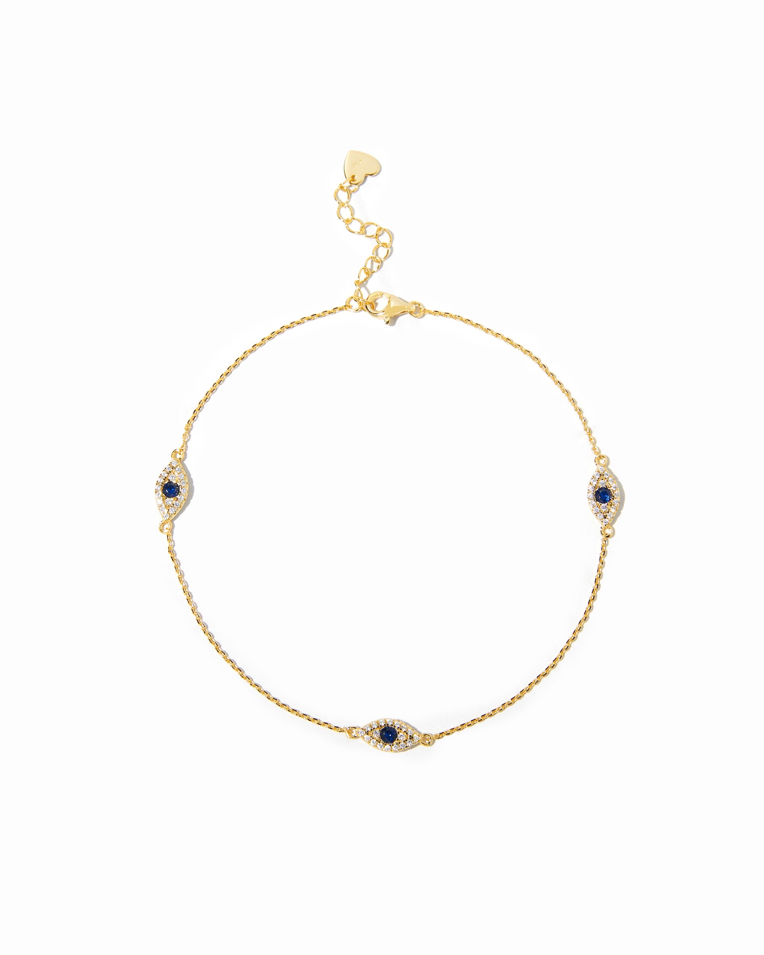 Delicate gold evil eye charm ankle bracelet with sapphire center.