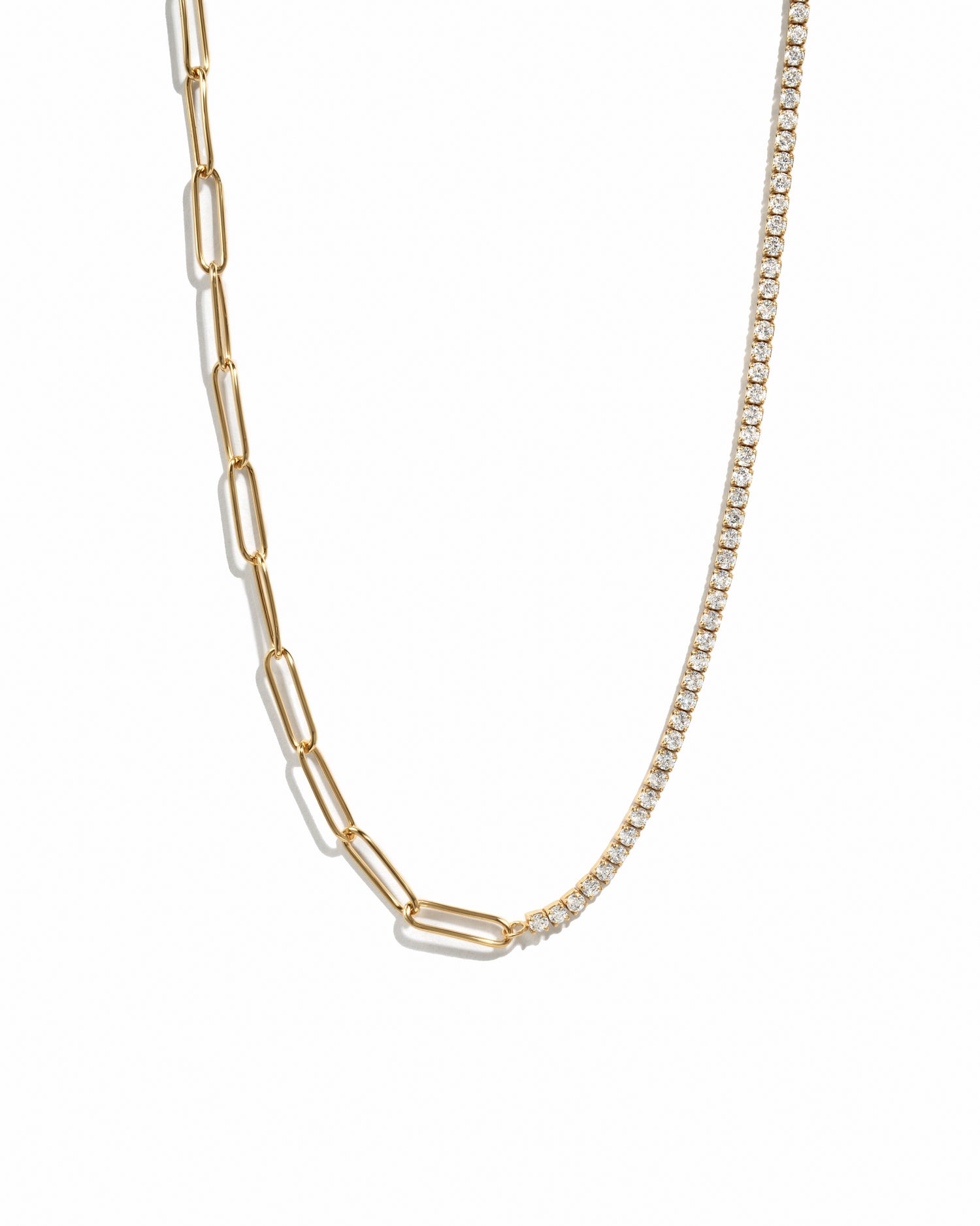 Gold trendy half tennis half paperclip chain necklace on white background