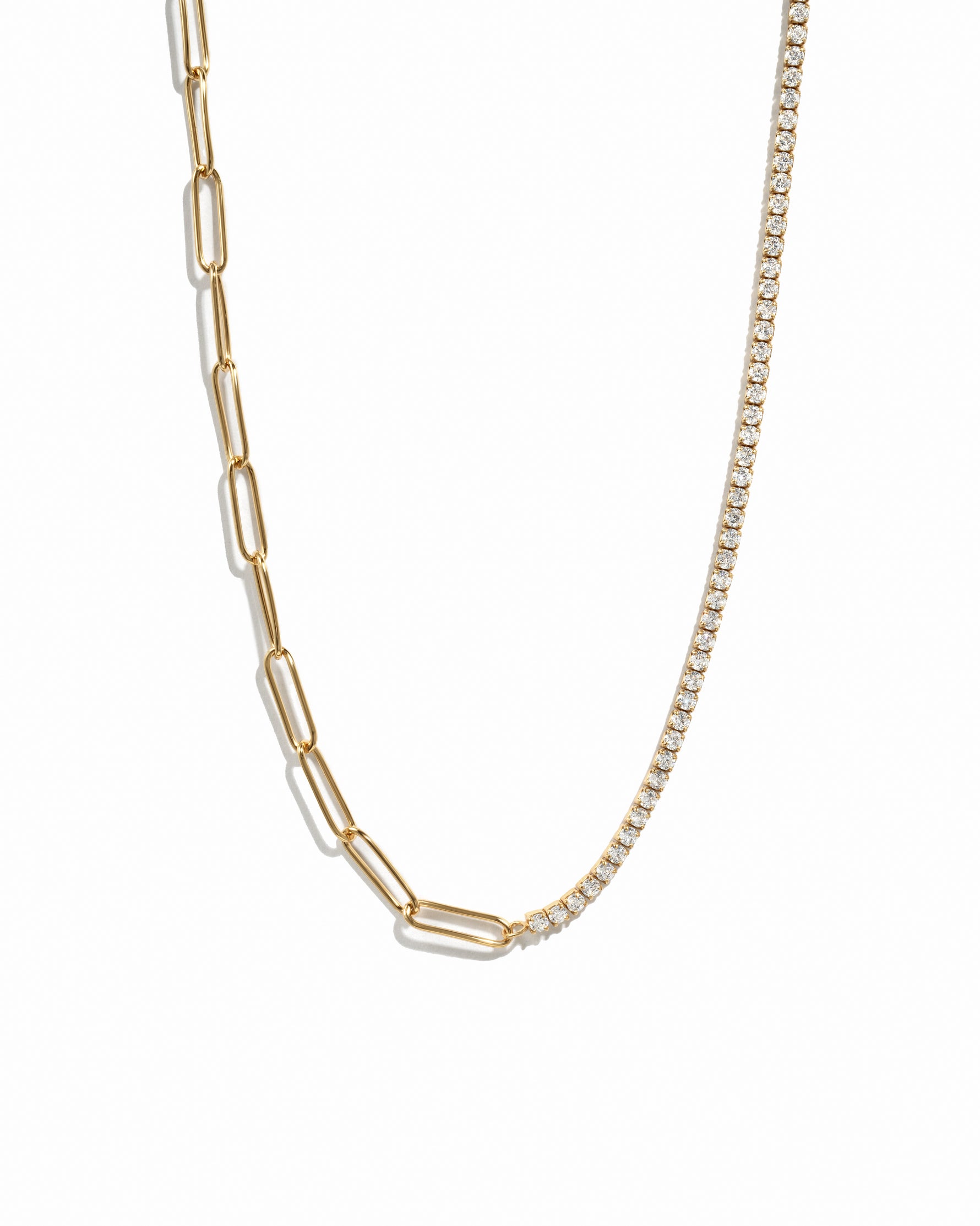 Gold trendy half tennis half paperclip chain necklace on white background
