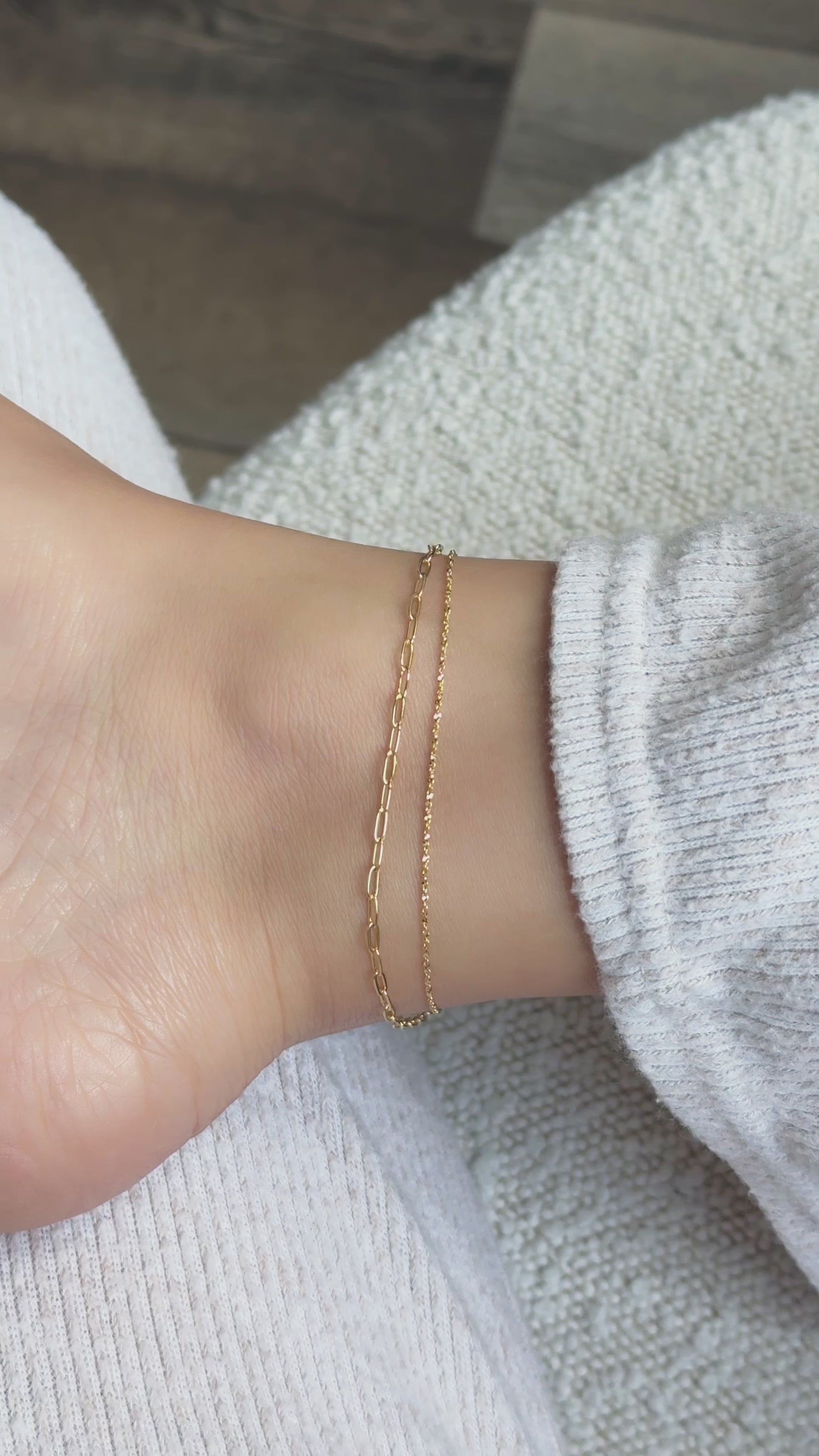 video of model showcasing their delicate and dainty gold ankle bracelet set