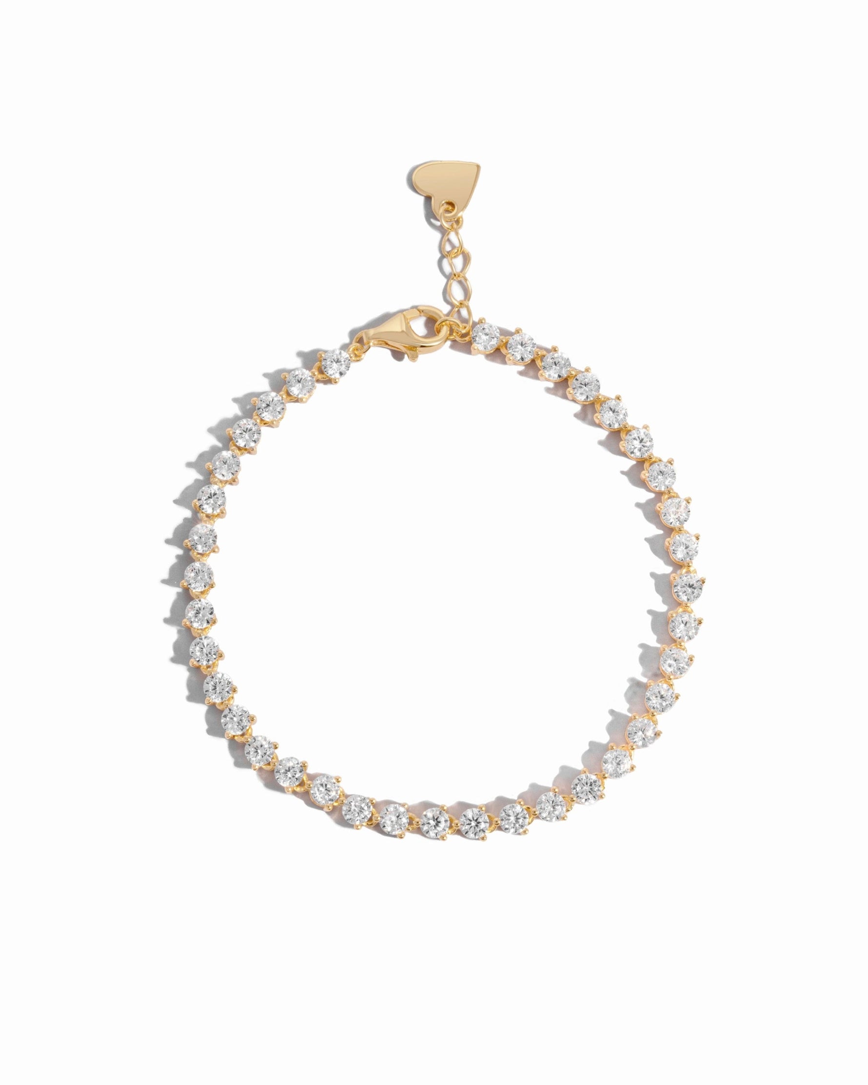 dainty gold tennis bracelet featuring cubic zirconia stones
