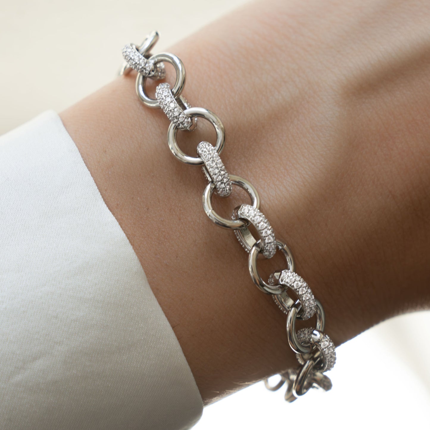 Model wearing silver chain statement jewelry