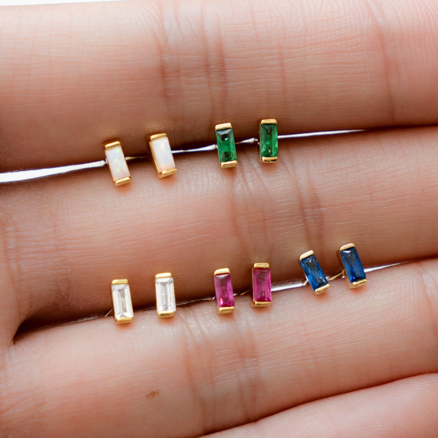 Model showcasing various birthstone gemstone earrings