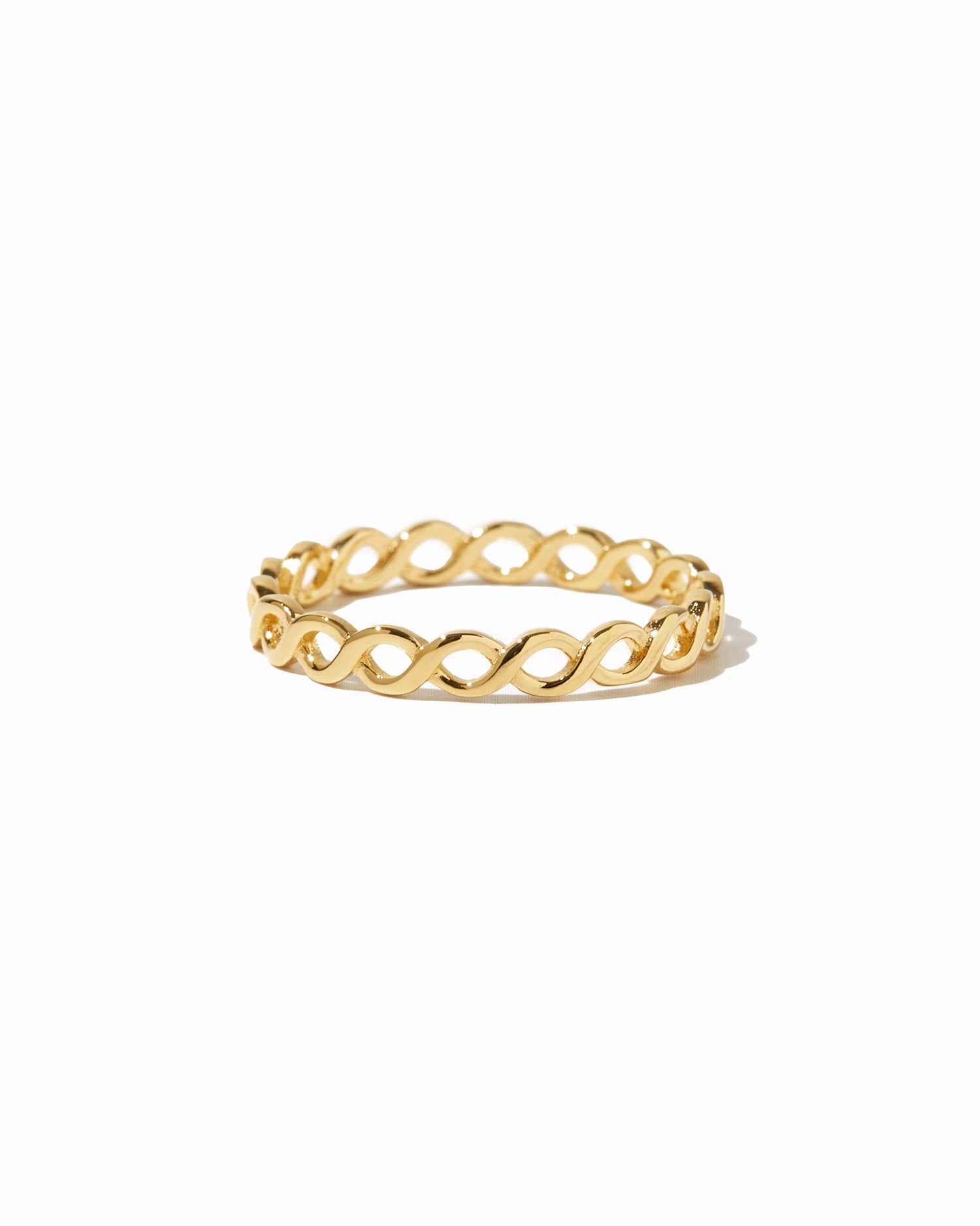 closeup image of gold braided eternity ring