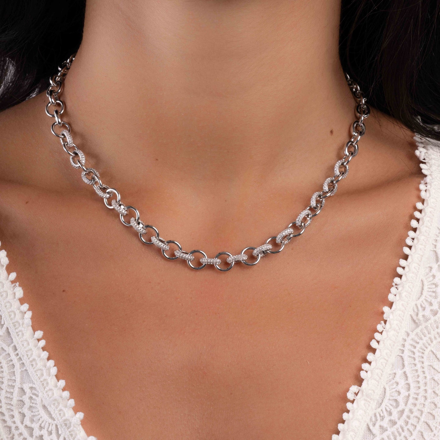 Model wearing diamond necklace featuring chunky chain design