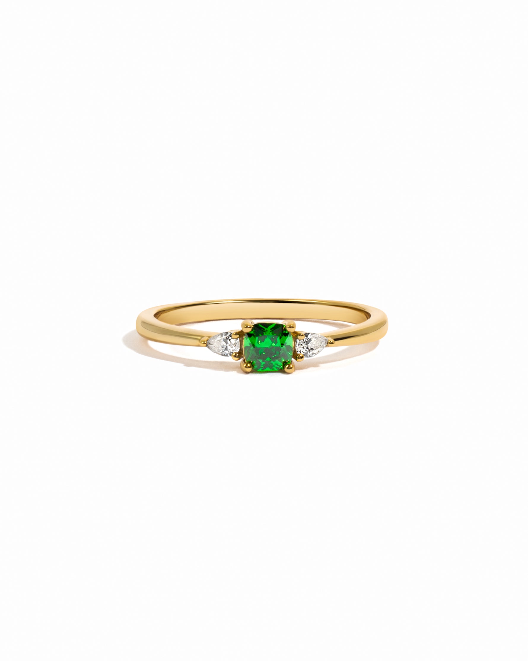 gold ring with emerald green cushion cut gemstone