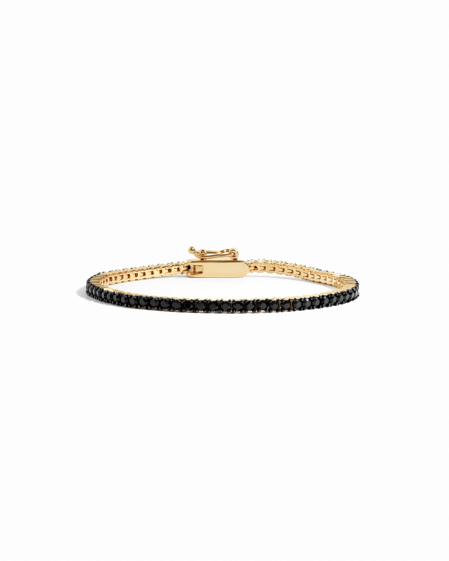 gold tennis bracelet with black stones