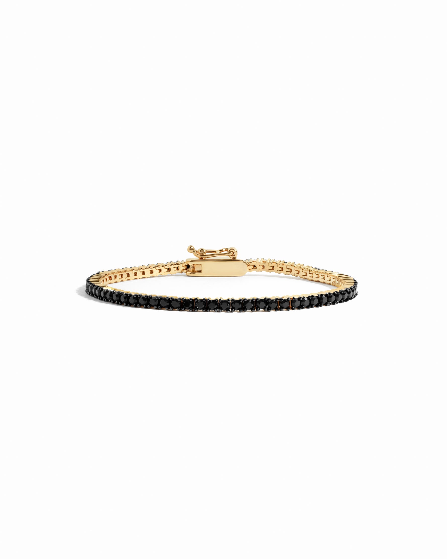 gold tennis bracelet with black stones