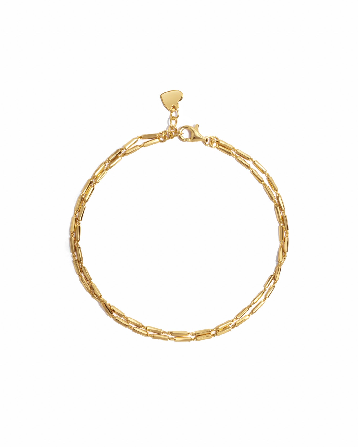 Closeup image of dainty gold bracelet set