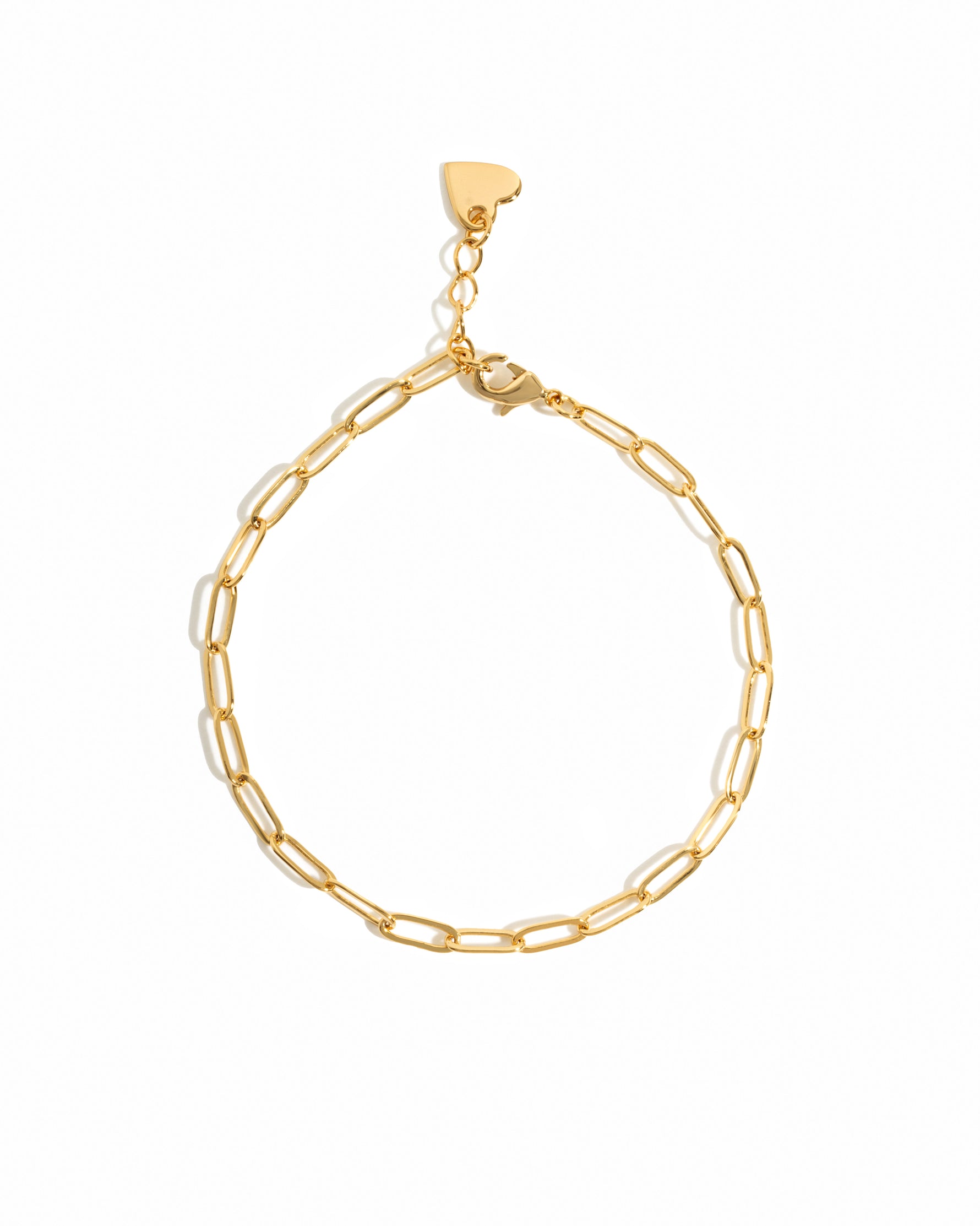 Gold small paperclip chain anklet on white background