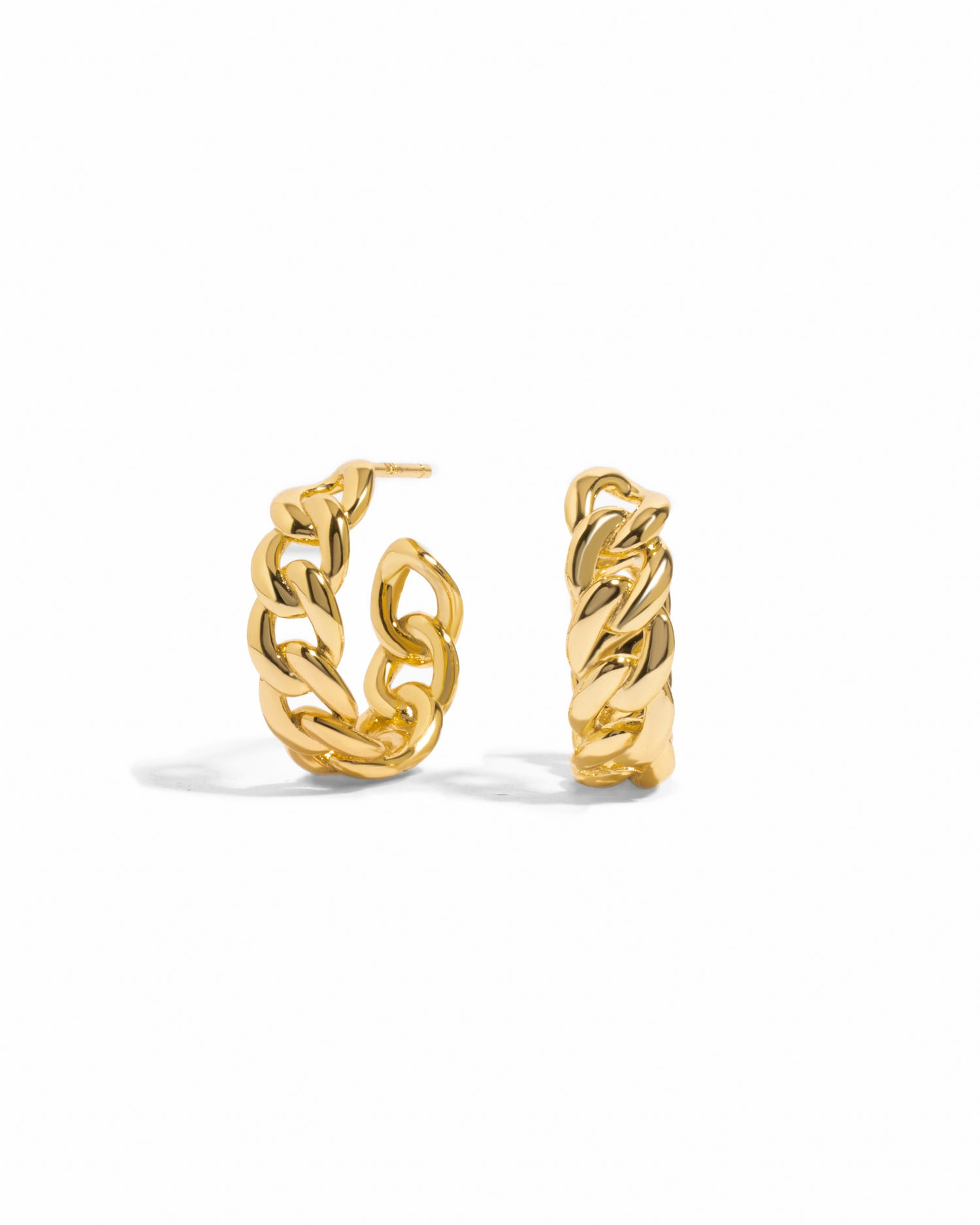 Gold chain hoop earrings on a white background