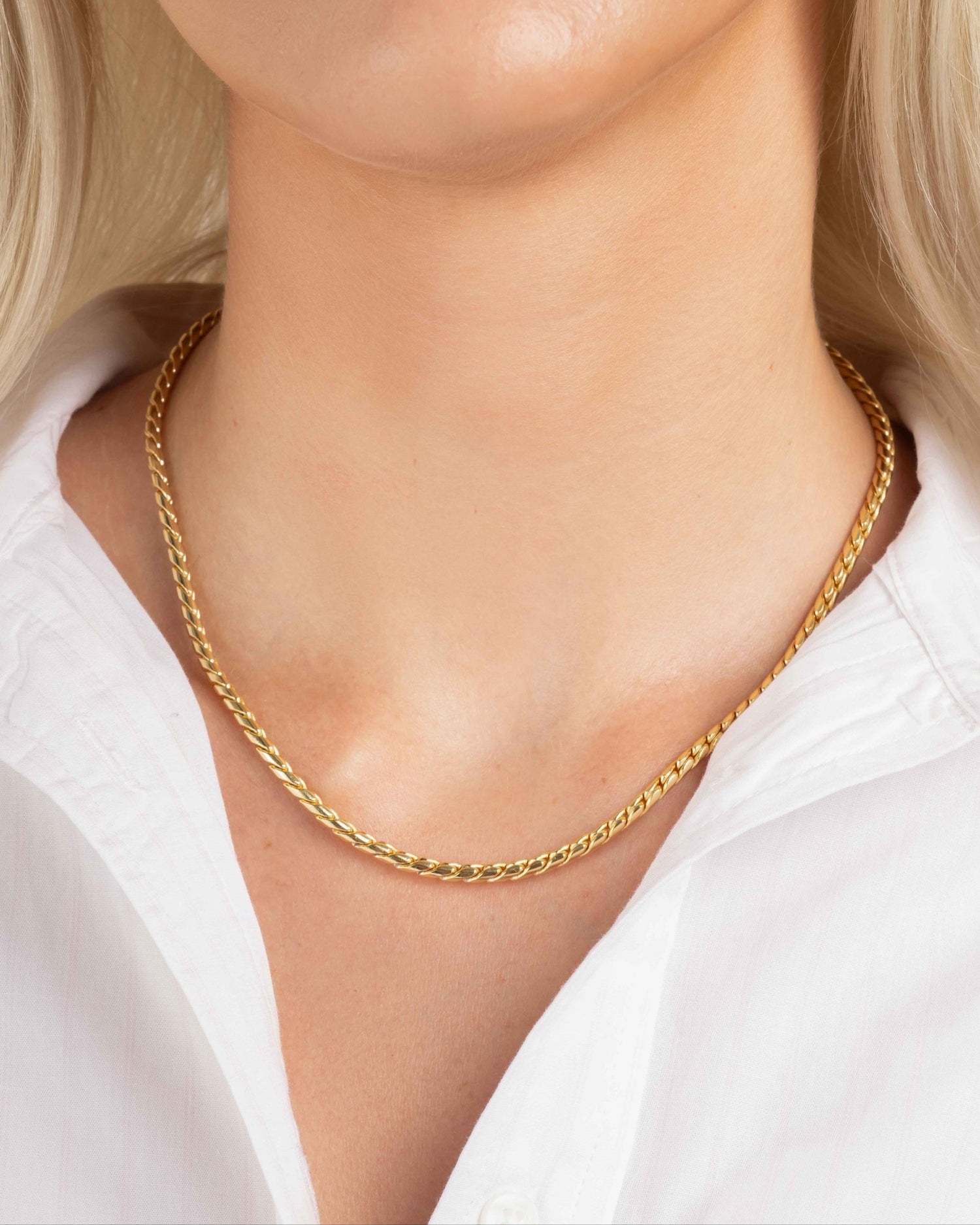 Gold rope chain necklace on model