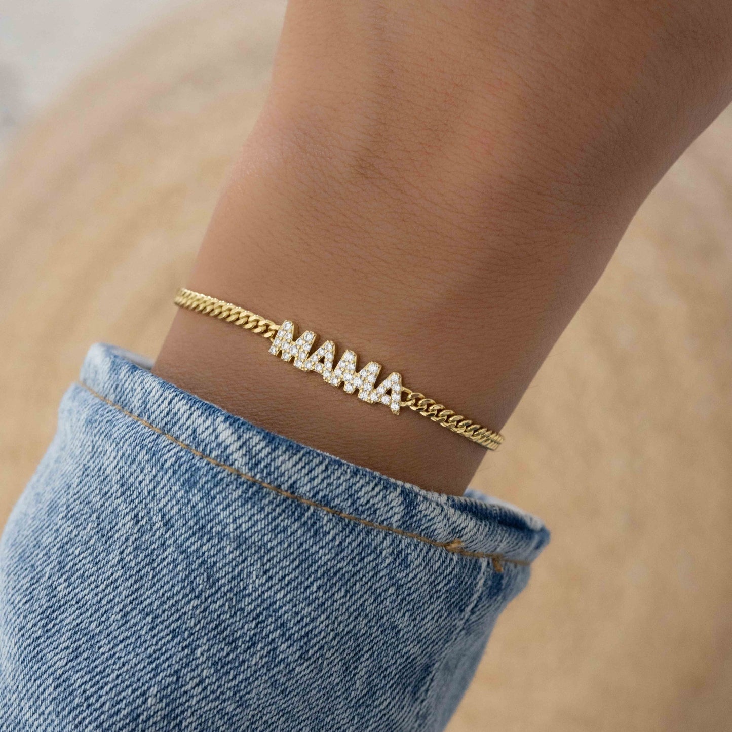 Model wearing MAMA 14k gold plated gold chain bracelet
