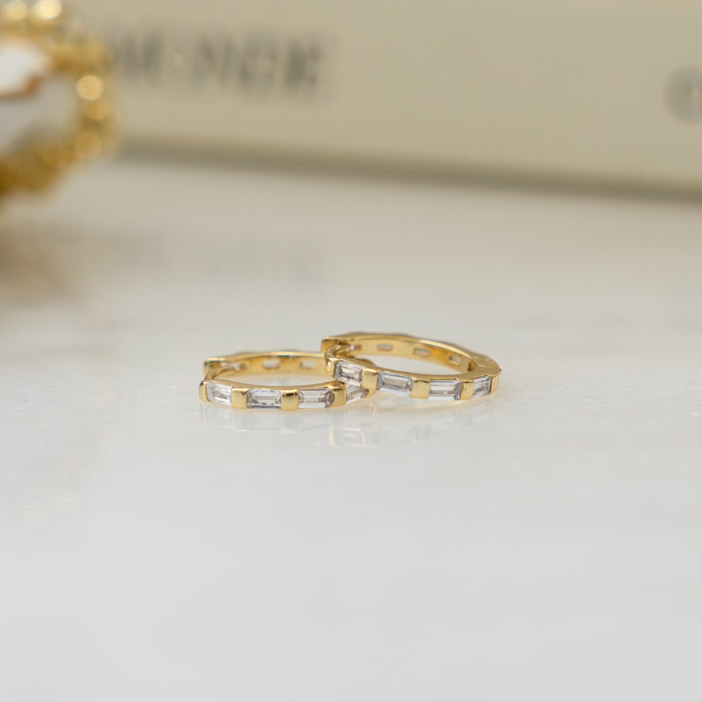 gold minimalist earrings with baguette cubic zirconia diamonds