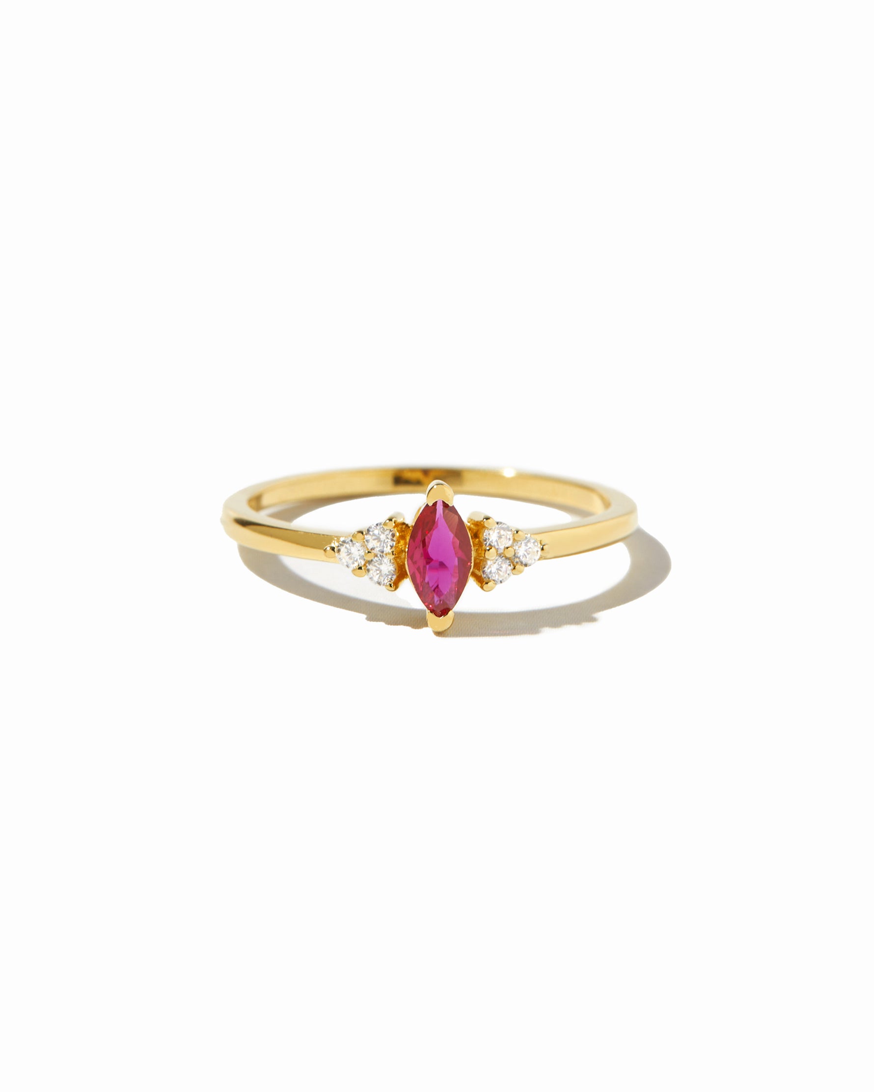 closeup image of gold ruby marquise ring
