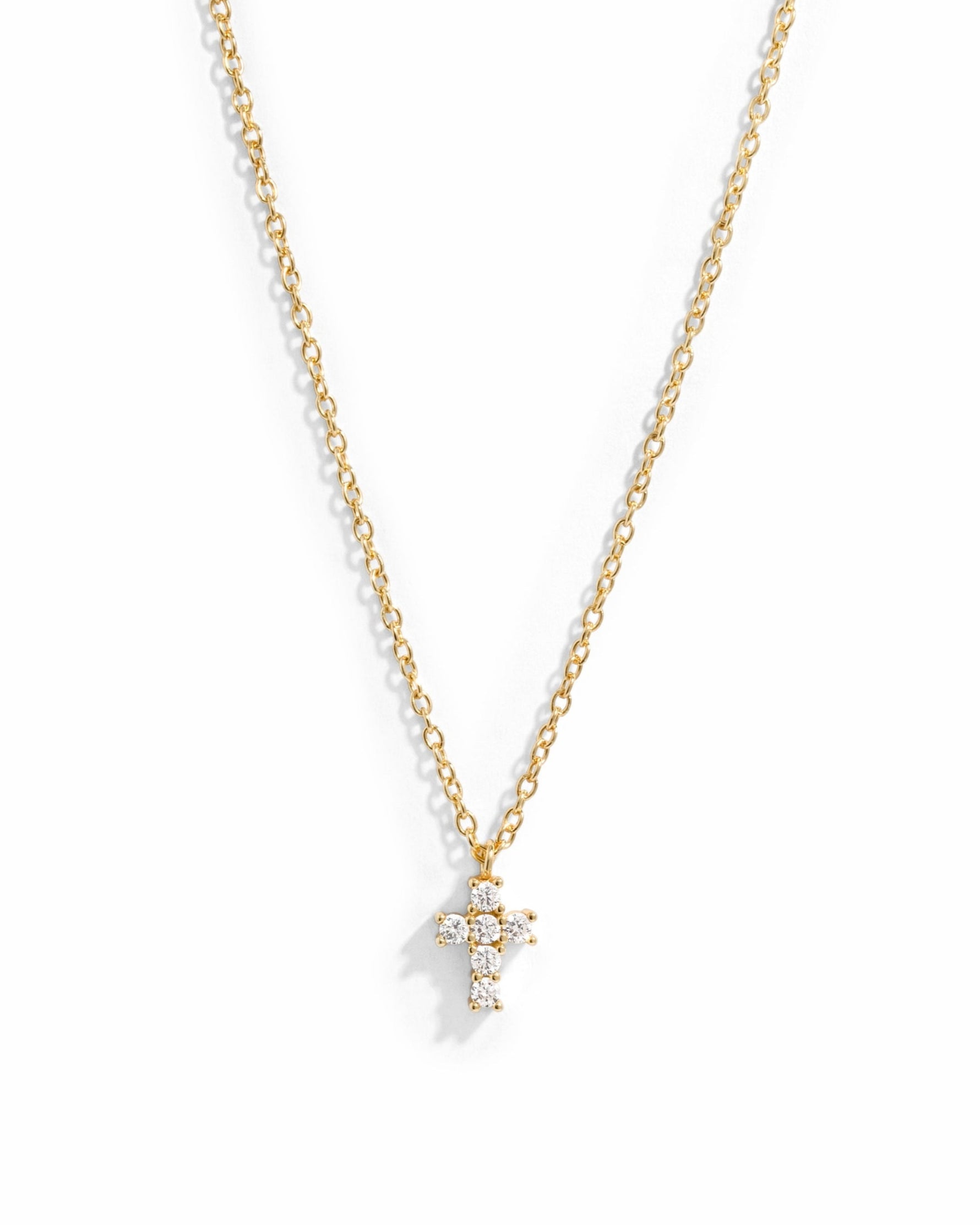 Gold necklace with a small cross pendant