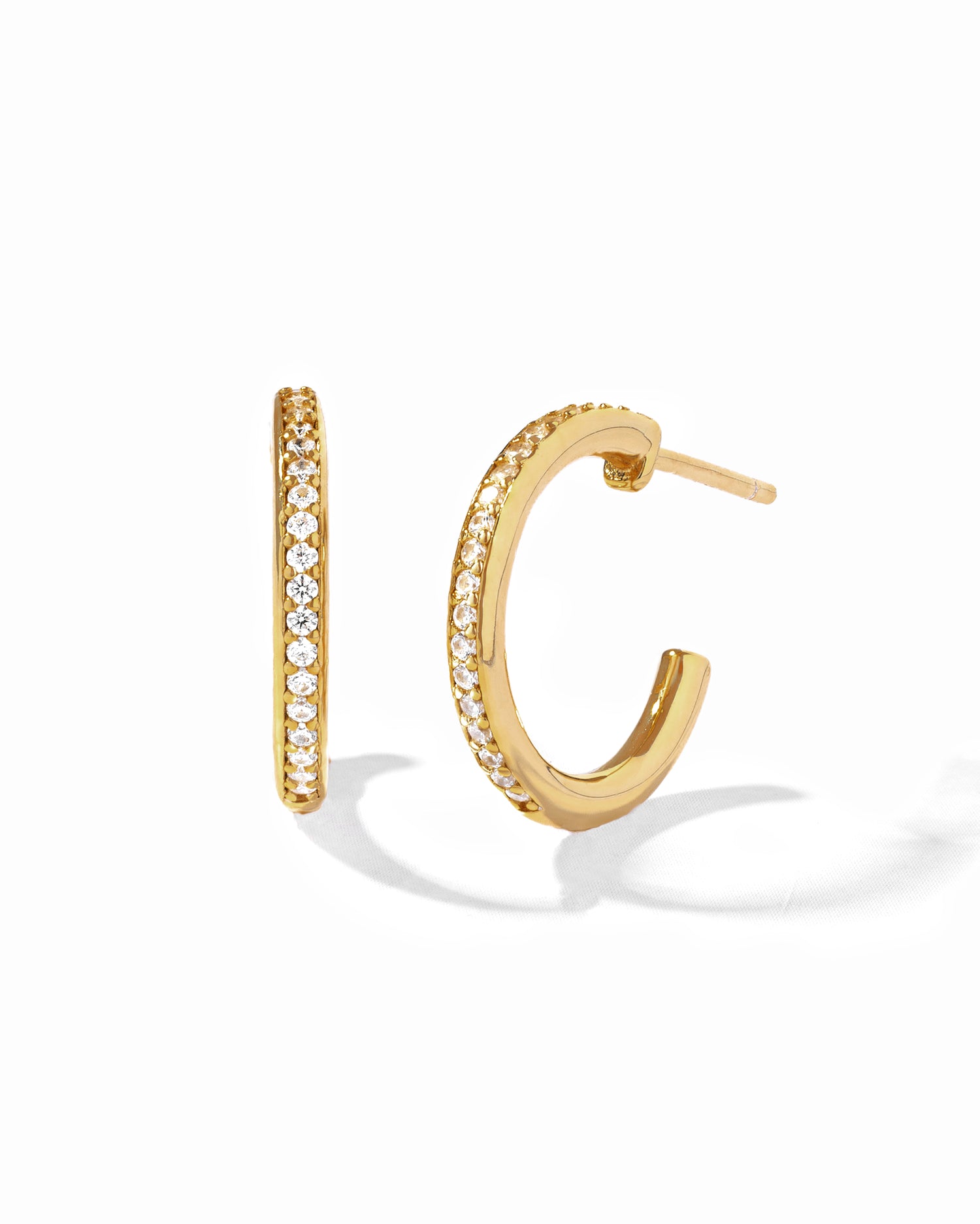 Dainty gold cz hoop earrings.