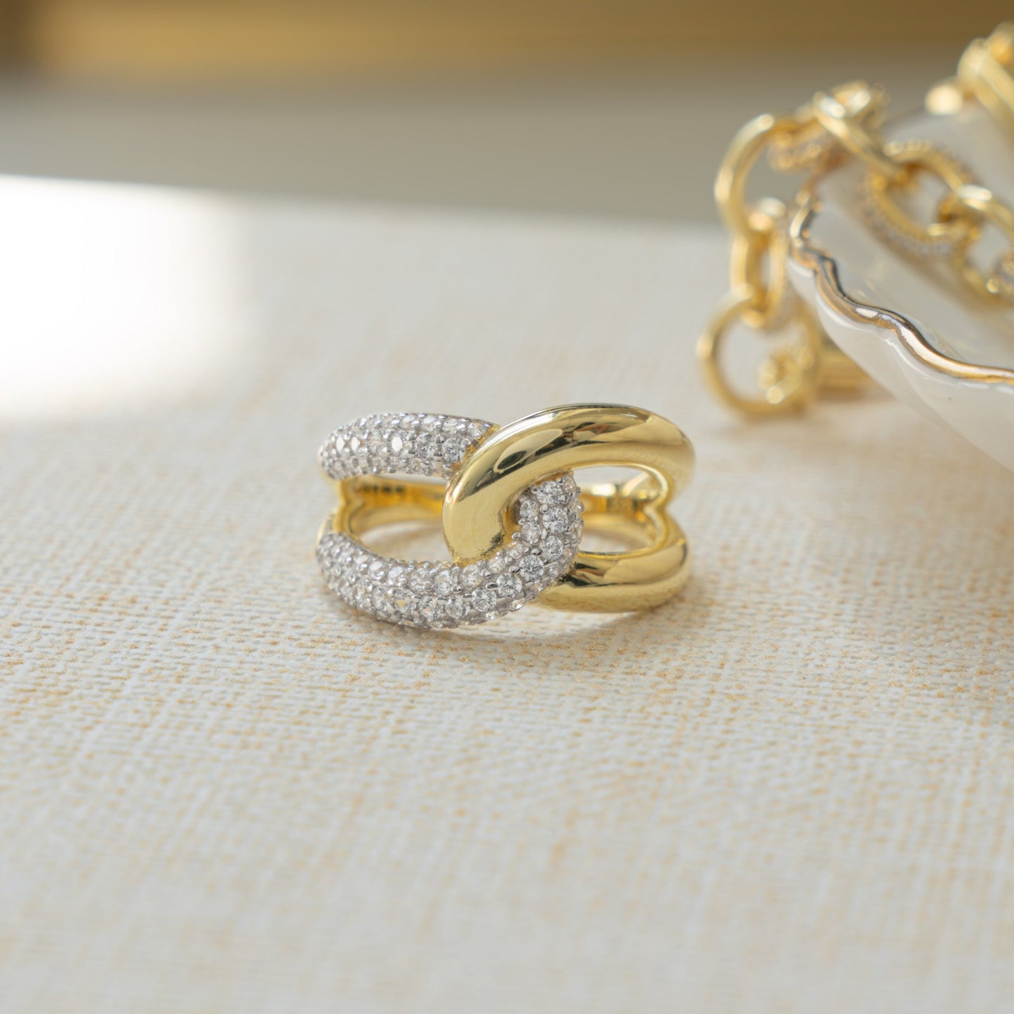 Closeup image of sterling silver criss cross ring with 14k gold plating