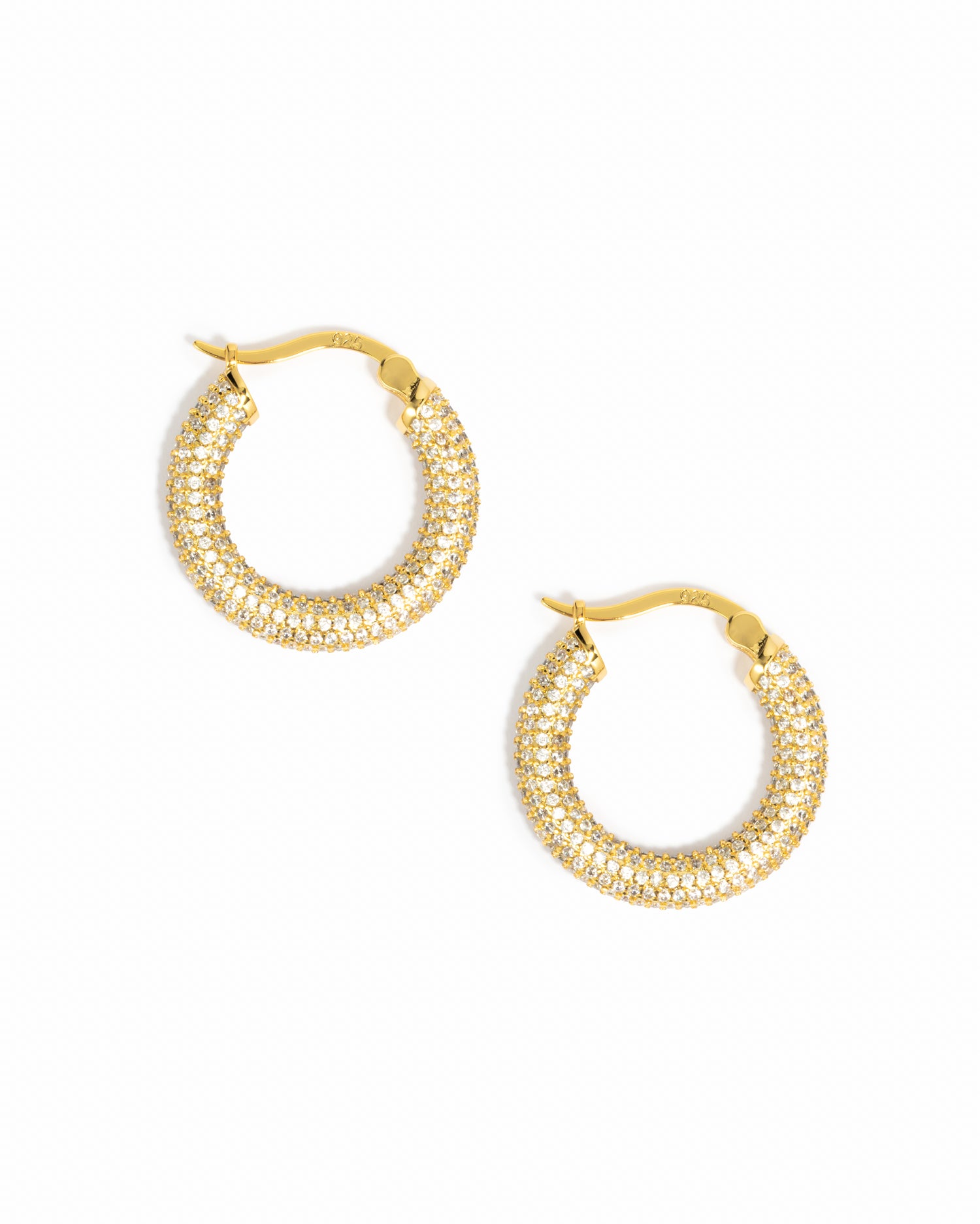 Gold cz hoop earrings on a white background