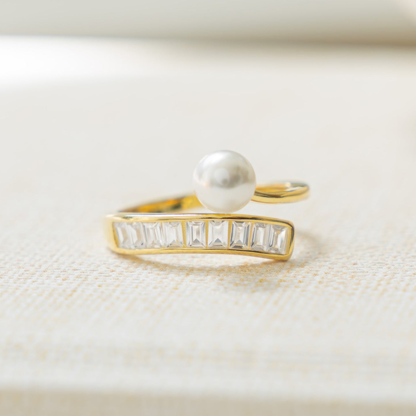 gold statement ring with wrap ring design and freshwater pearls