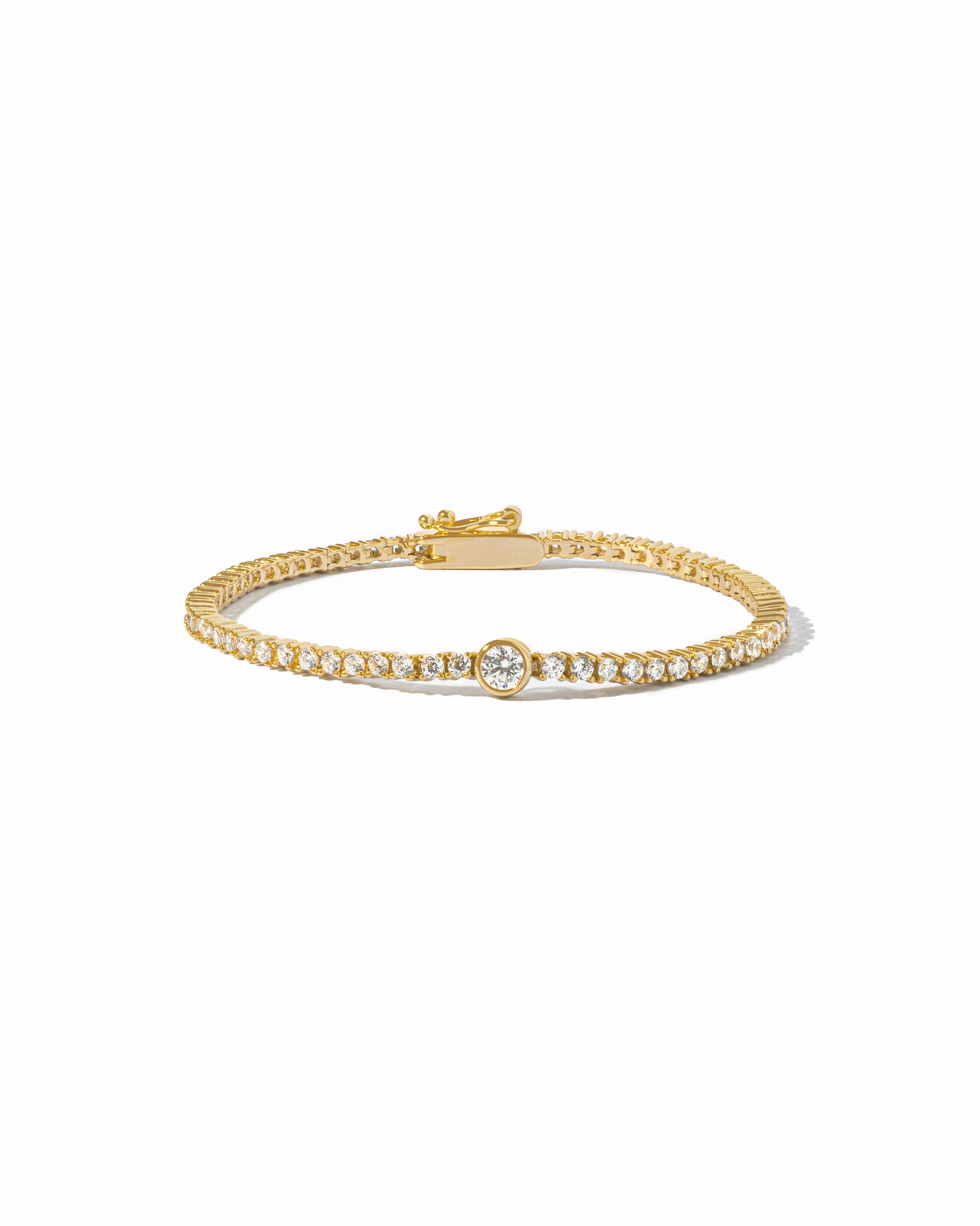 gold round bezel charm tennis bracelet