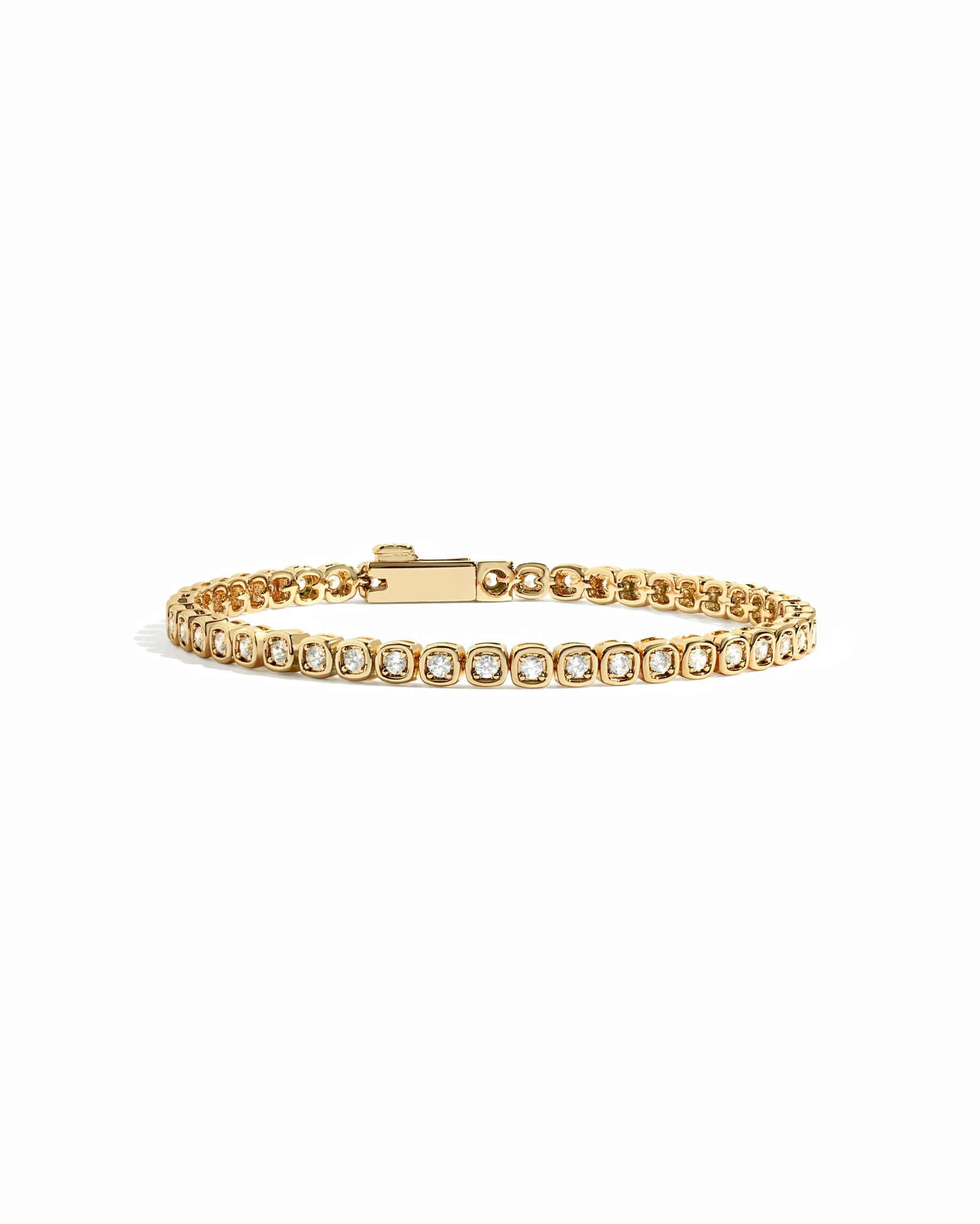 Gold square tennis bracelet on white background
