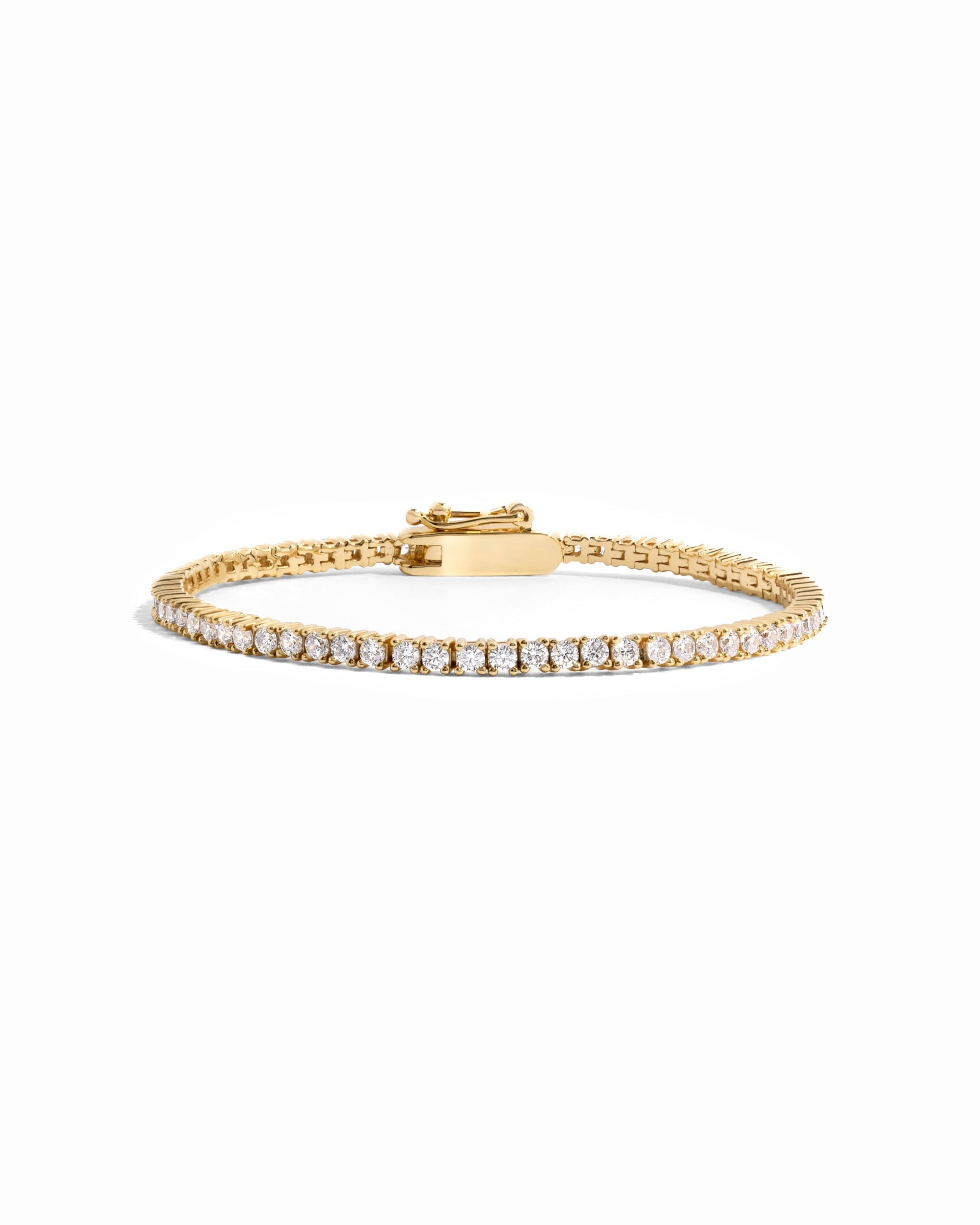 gold tennis bracelet with latch clasp