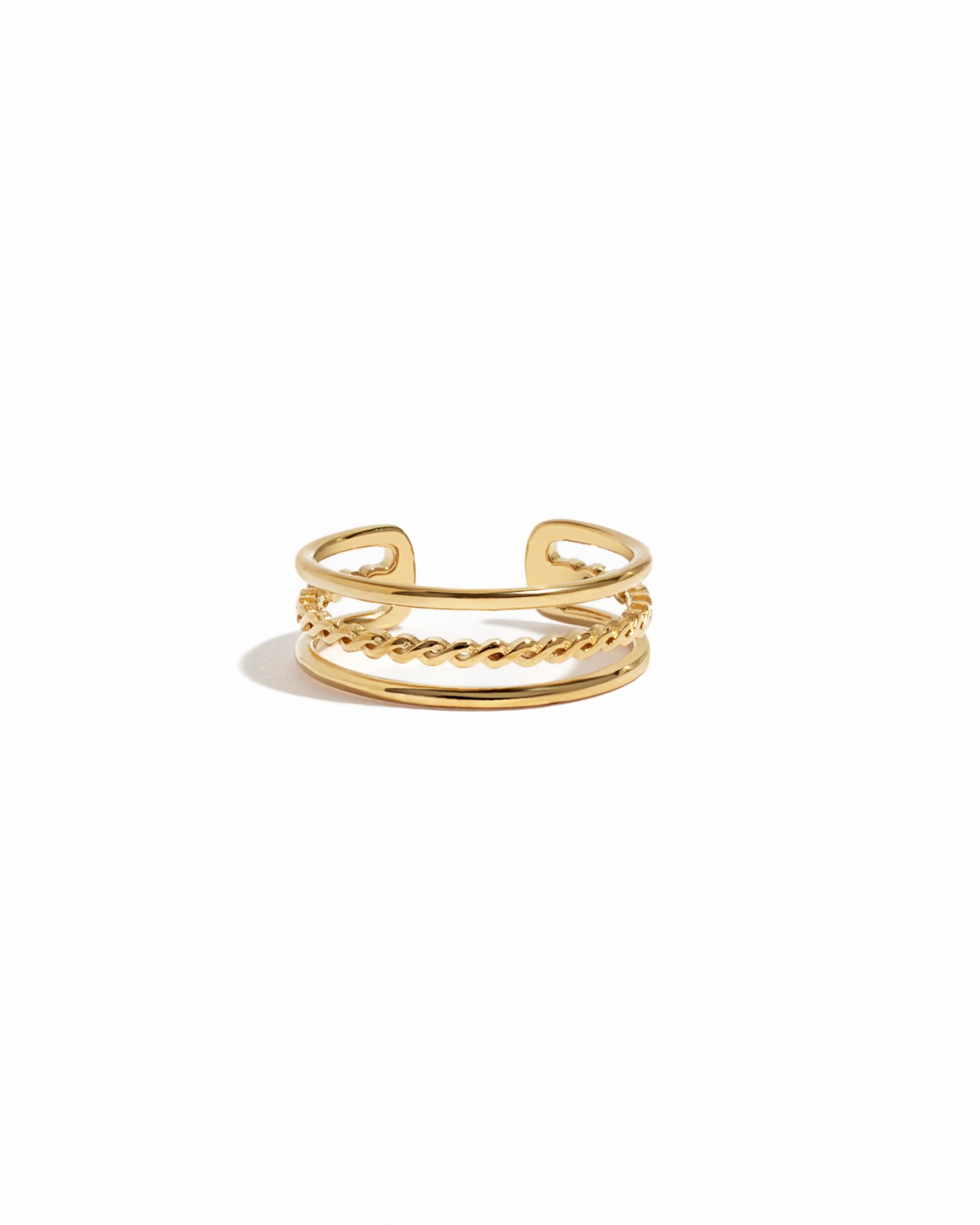 Gold toe ring with chain detail on a white background