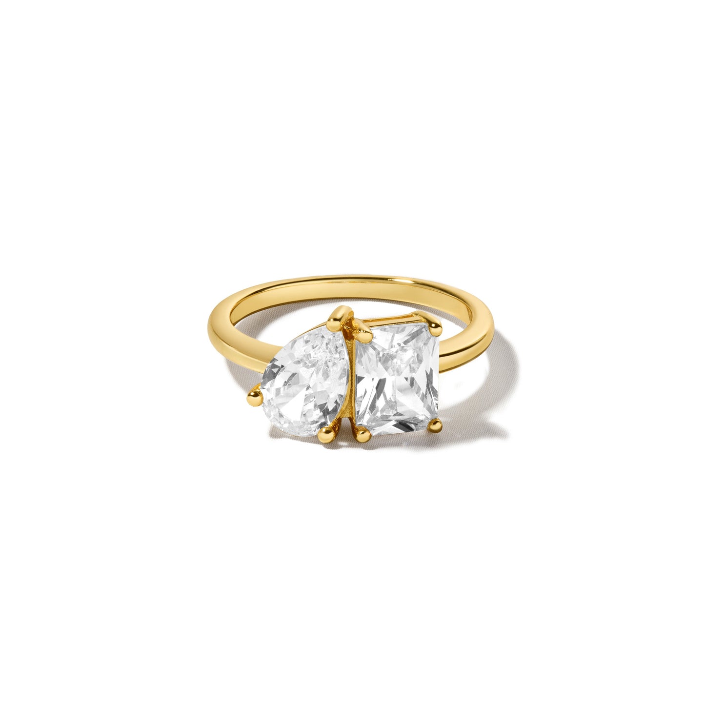 gold pear-cut and emerald-cut diamond ring