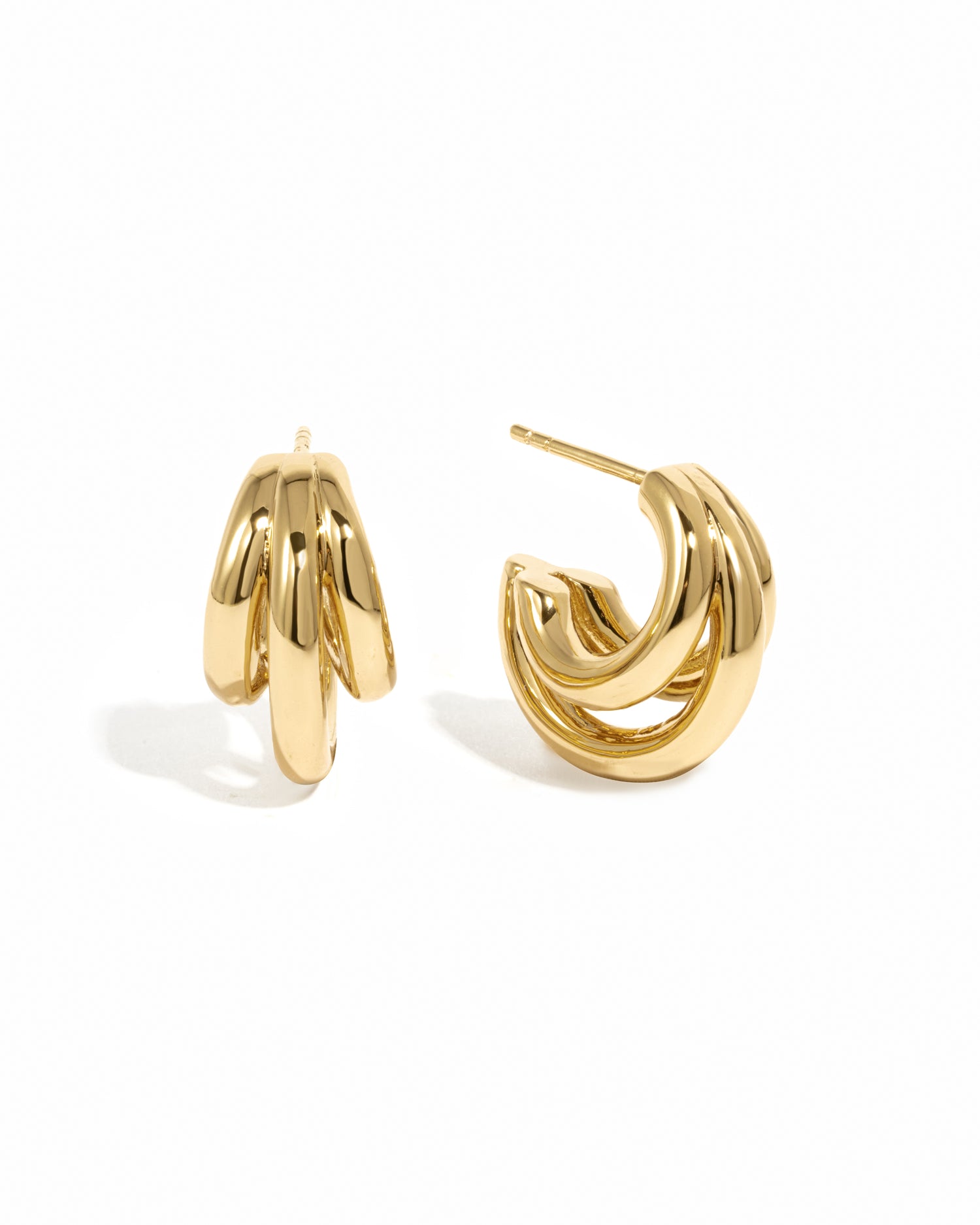 Gold hoop earrings on a white background