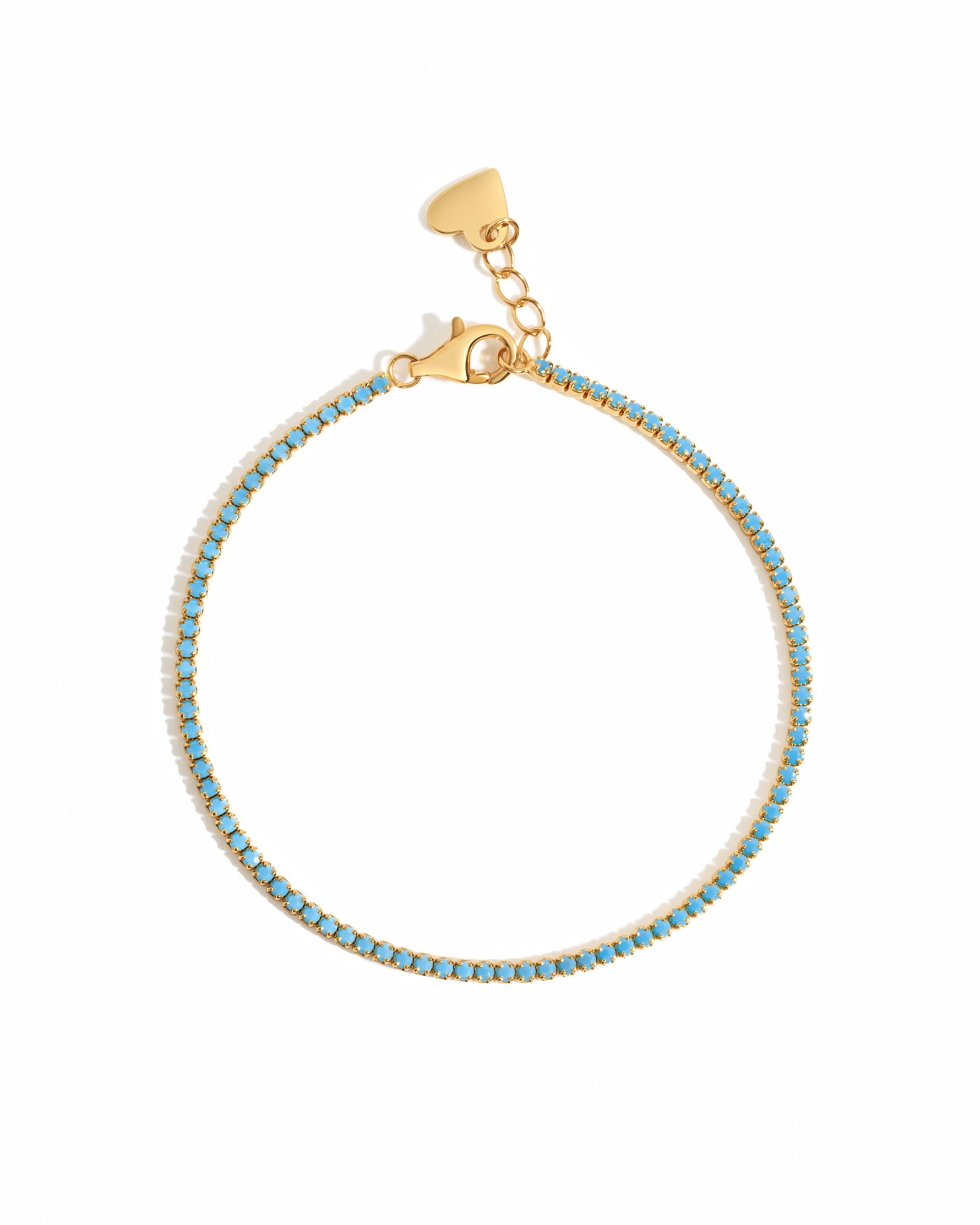 Gold turquoise tennis bracelet on a white background