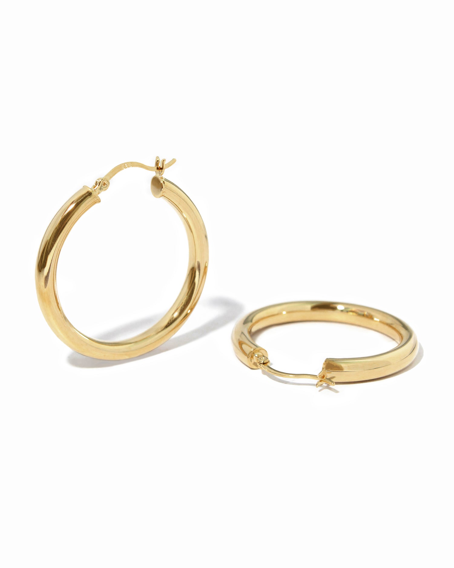 Lightweight chunky hoop earrings, classic madison beer hoop earrings on white backround