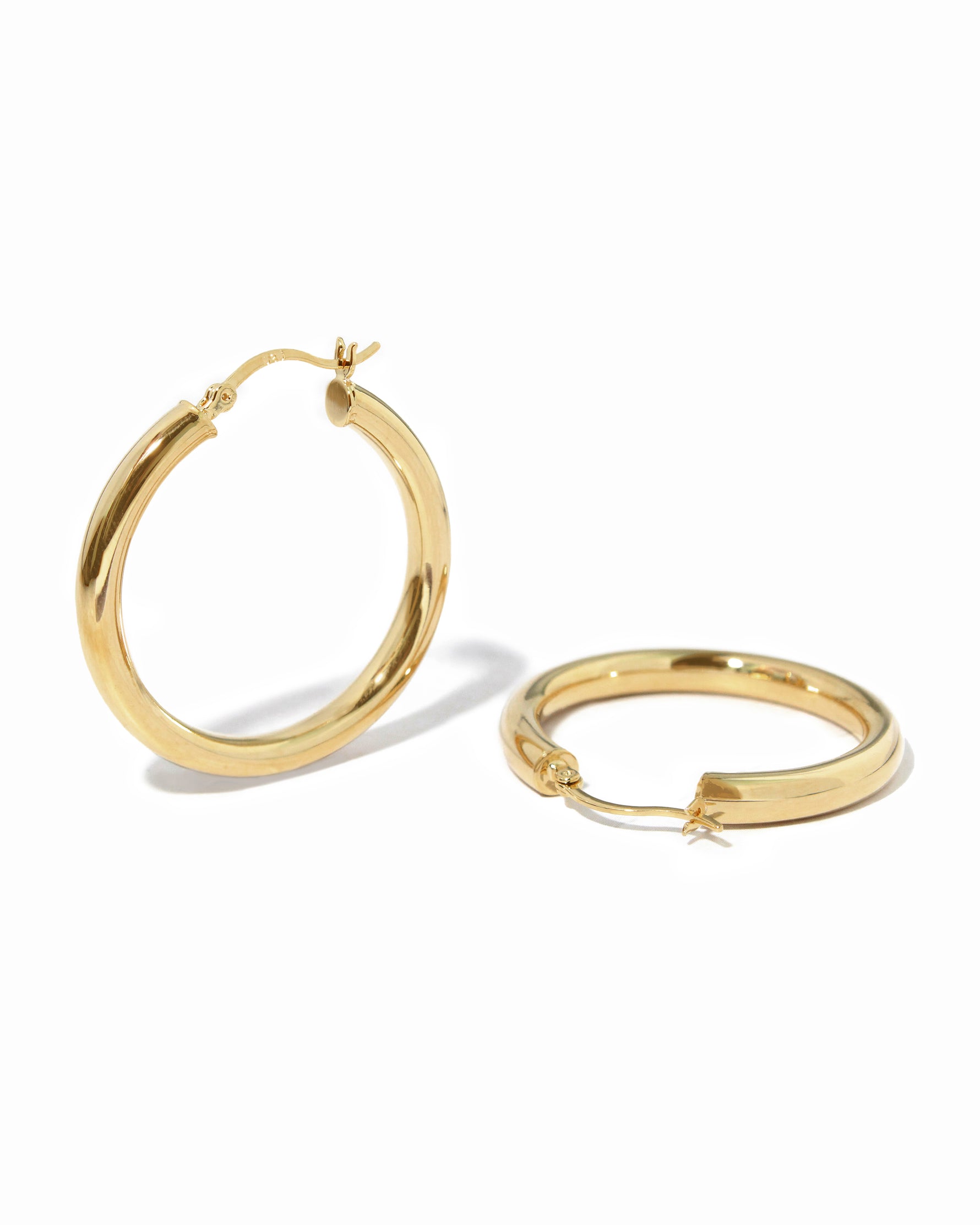 Lightweight chunky hoop earrings, classic madison beer hoop earrings on white backround