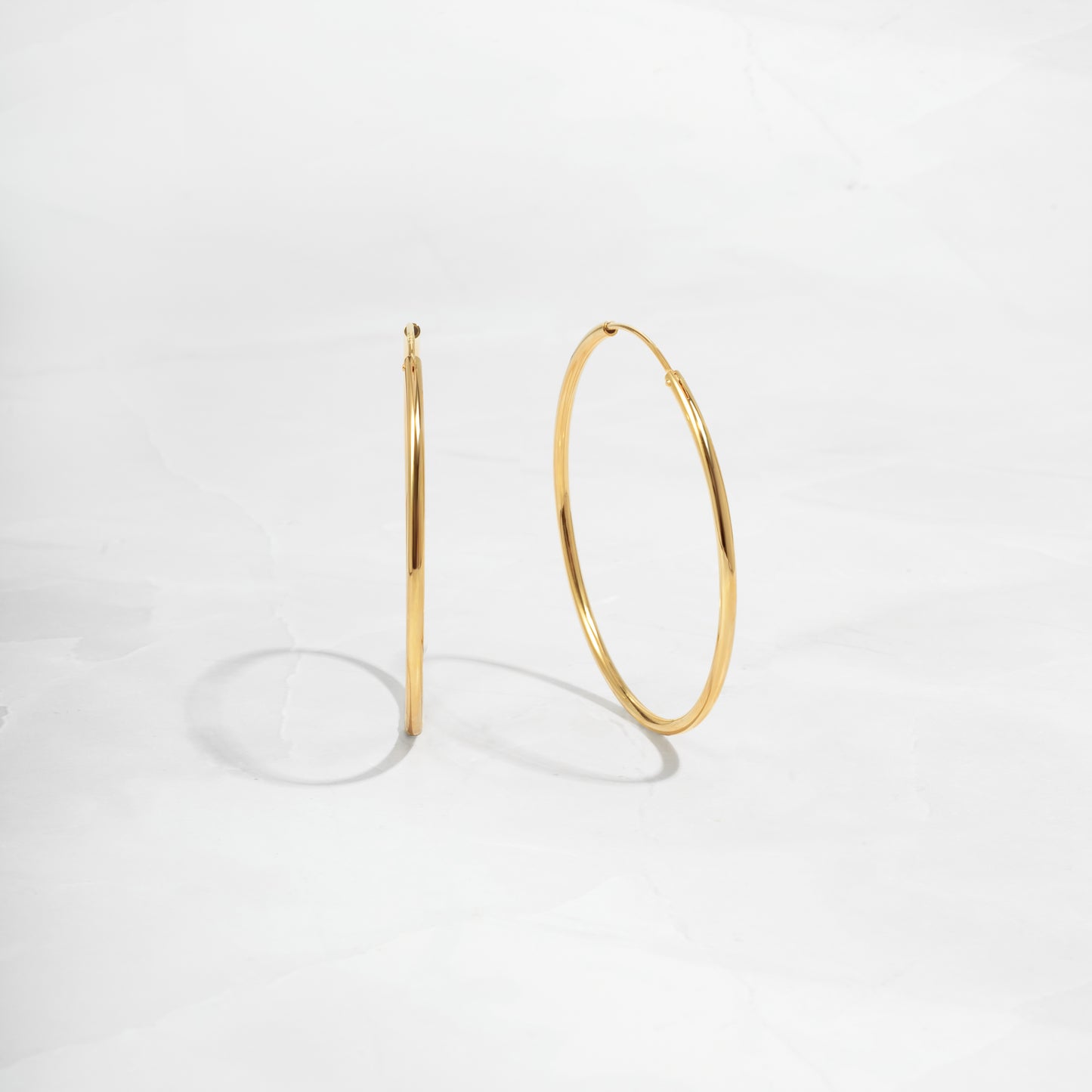 Closeup image of thin hoop earrings