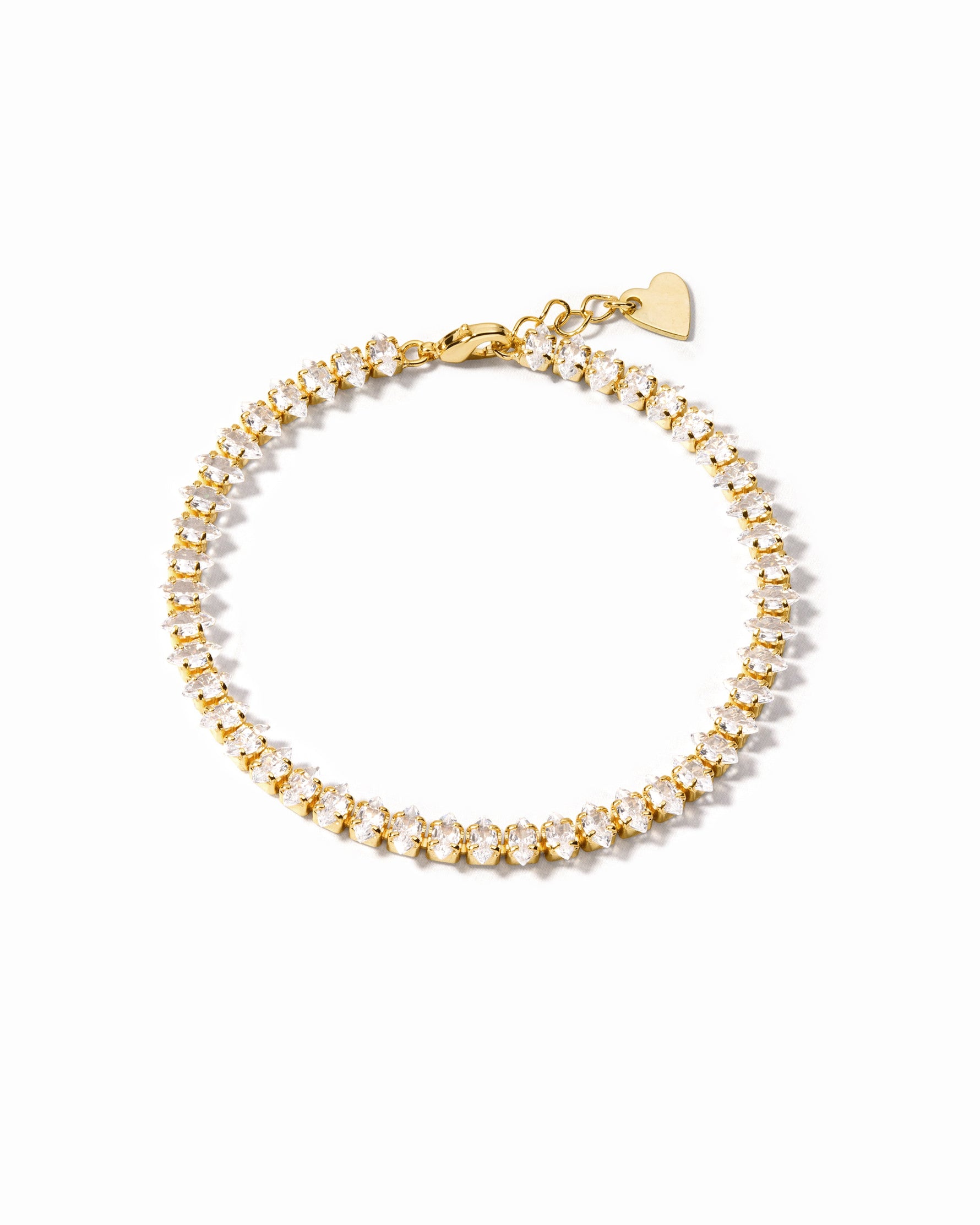 Gold marquise ankle bracelet on white background
