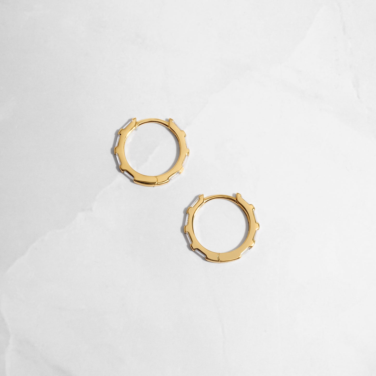 image of dainty gold huggie hoops