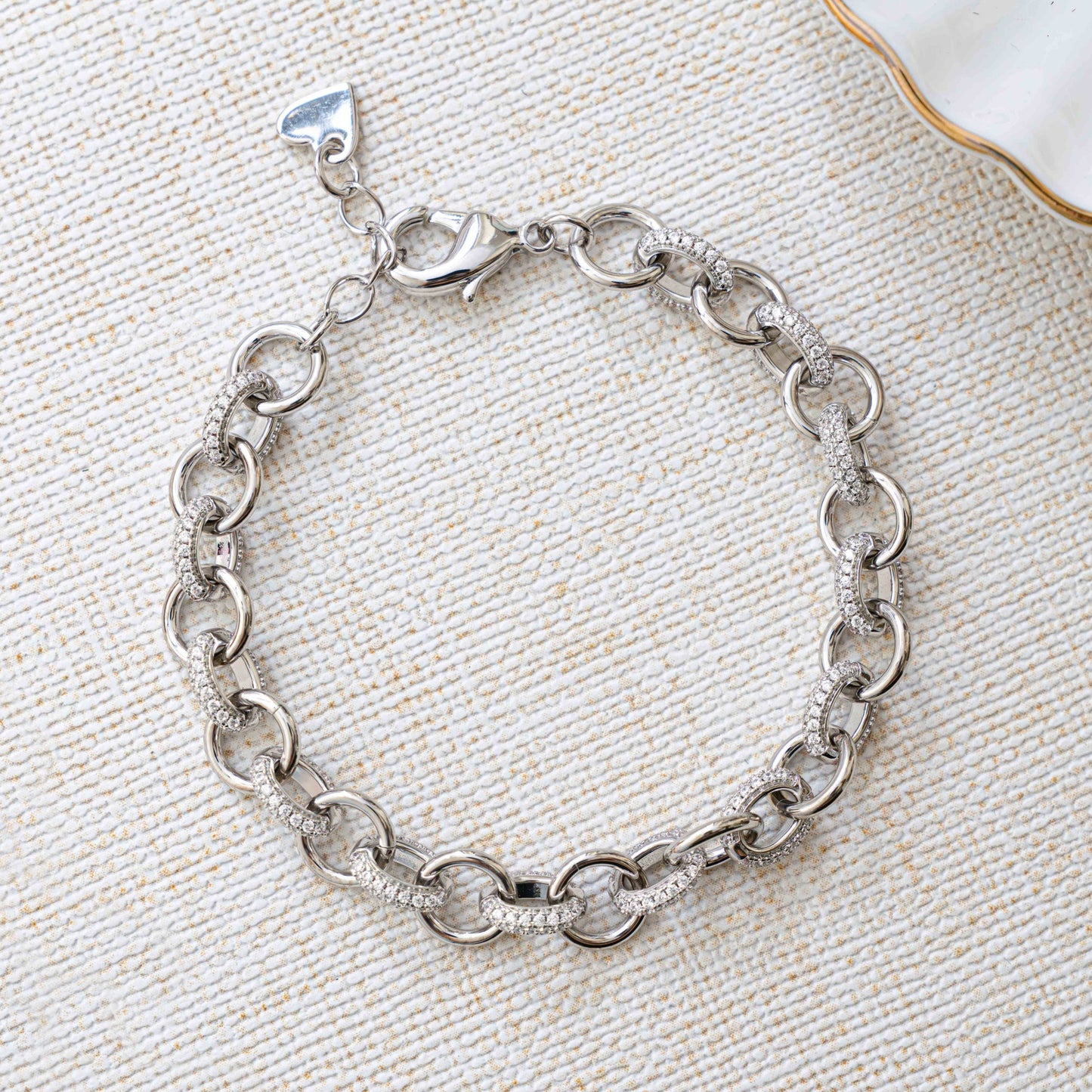 Closeup image of silver chain with chunky jewelry design