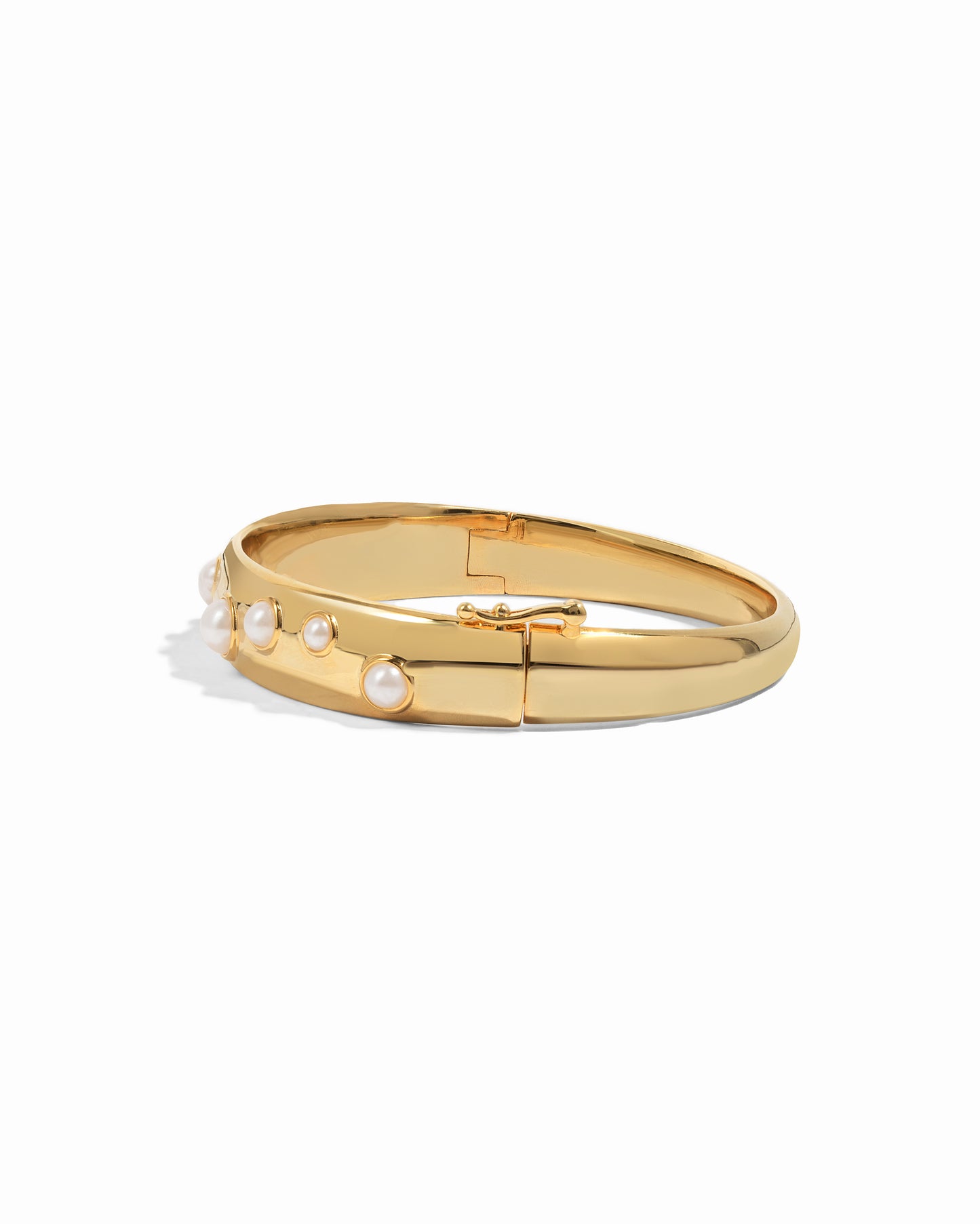 gold bangle bracelet with studded pearl design