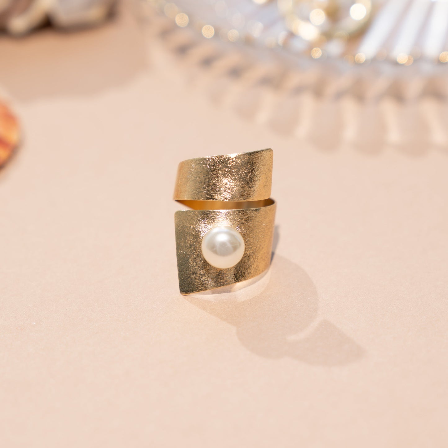 closeup image of pearl ring with spiral ring design