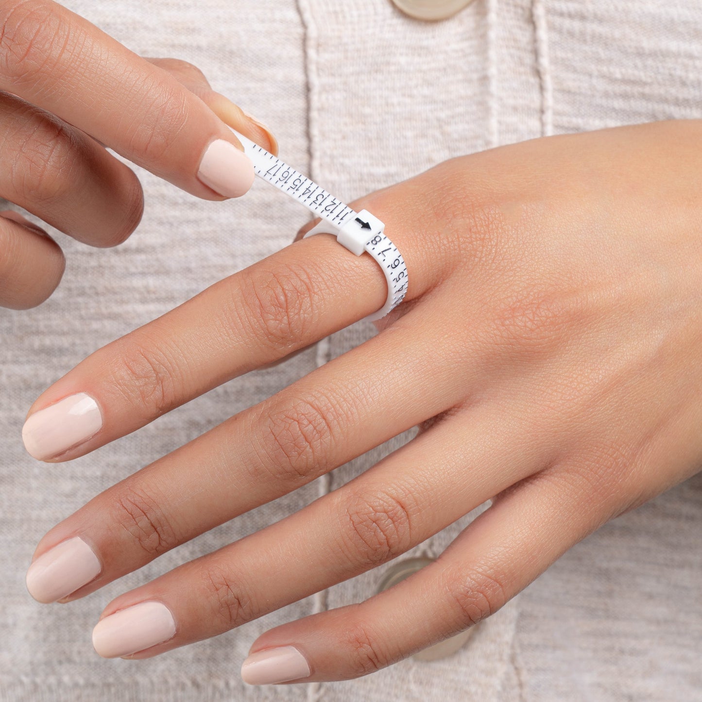 model wearing ring sizer tool