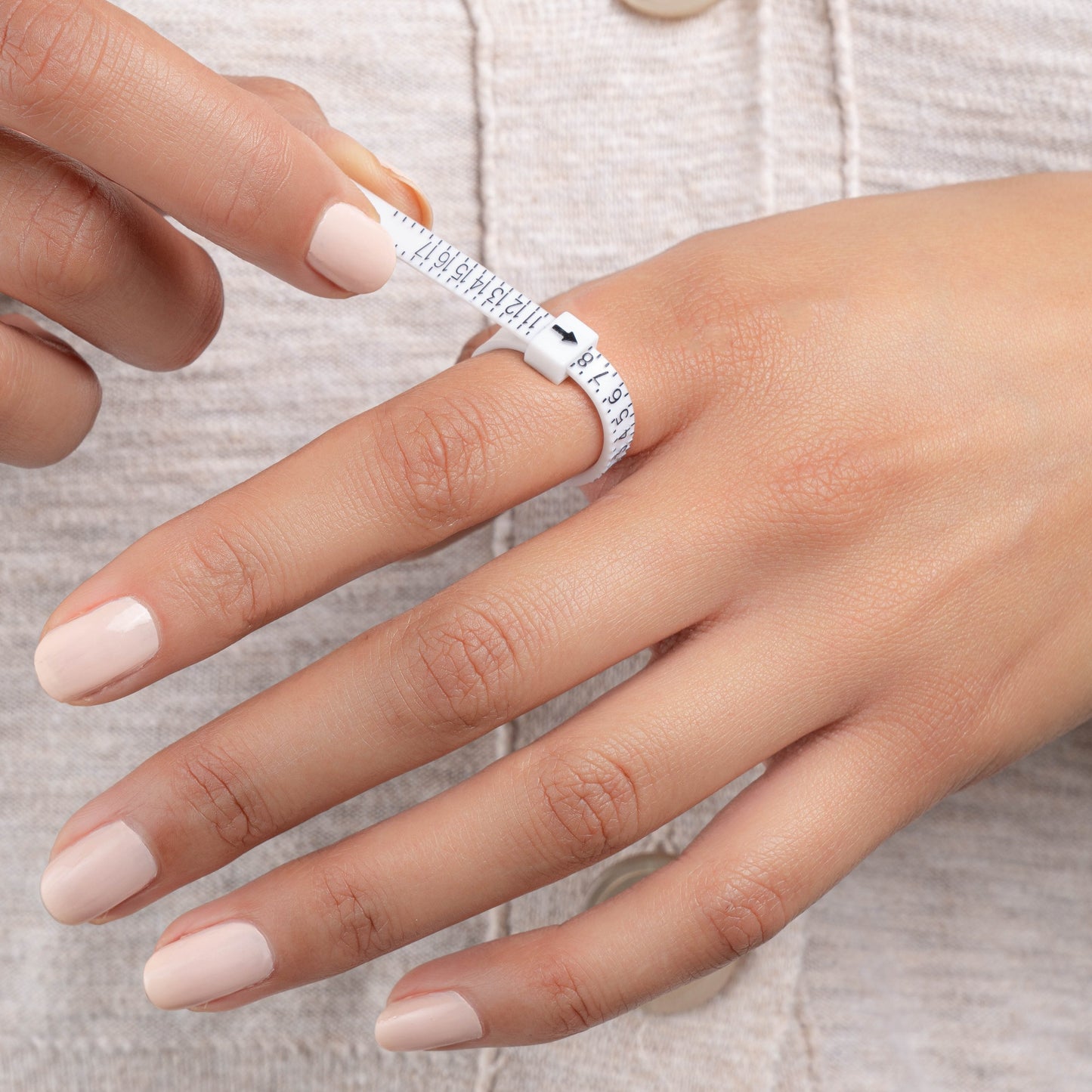 model wearing ring sizer tool