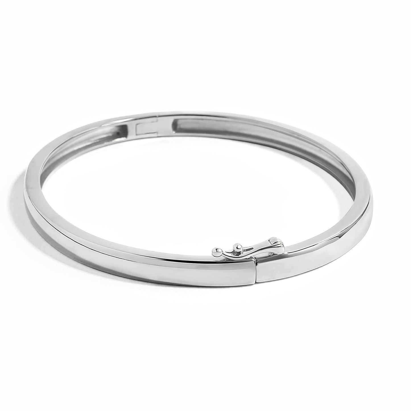 closeup image showcasing the latch clasp on a silver bangle bracelet