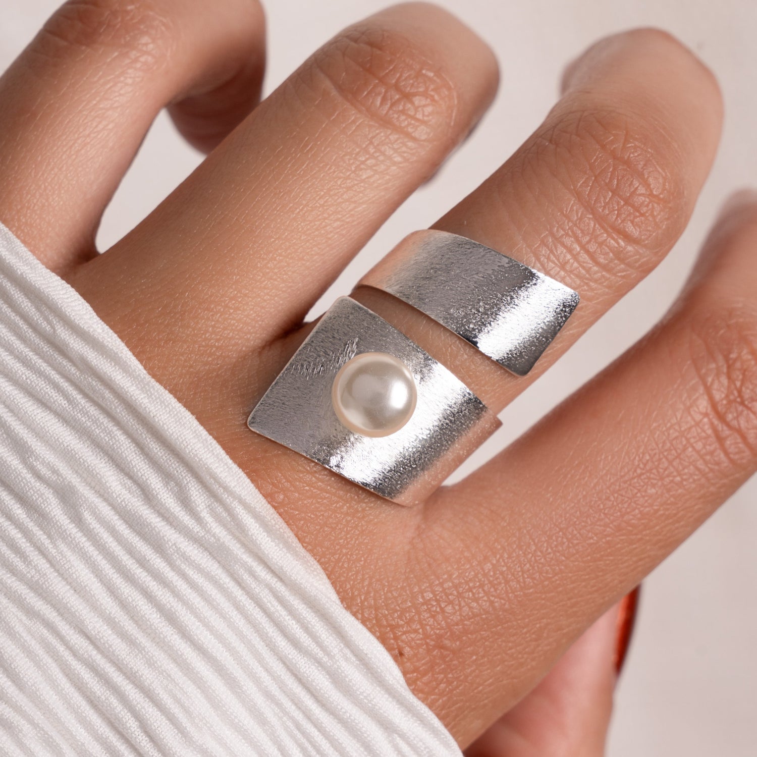 model wearing statement jewelry featuring bohemian spiral ring