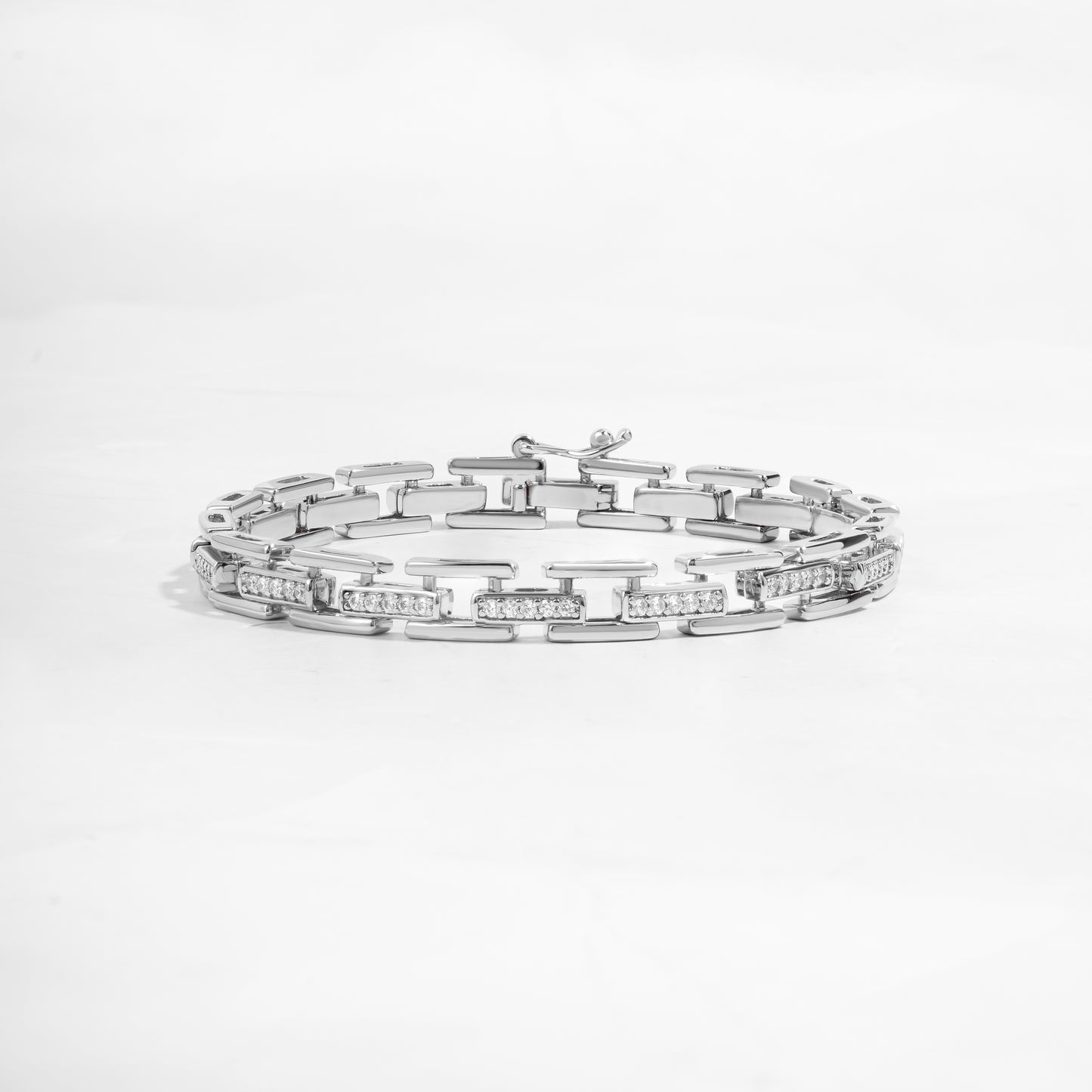 closeup image of statement jewelry featuring a silver chain link bracelet